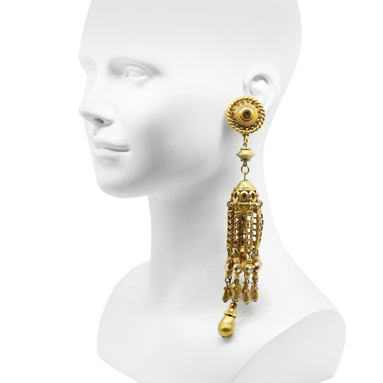 Vintage Unsigned Claire Deve Gold Tone Long Dangling Earrings.  Has Rose Colored Rhinestones and Gold Tone Colored Beads with a Faux Pearl dangling at the end. Lots of dangling Gold Pieces come together to make this all swirl together to make this