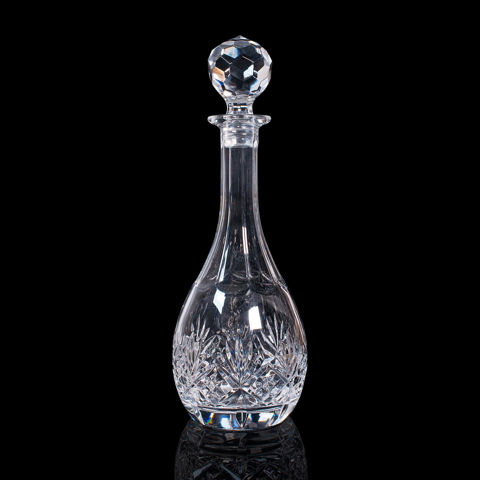 This is a vintage claret decanter. An English, cut glass wine vessel, dating to the mid 20th century, circa 1960.

Striking decanter with a superb stopper
Displays a desirable aged patina throughout
Cut glass in good order throughout with fine