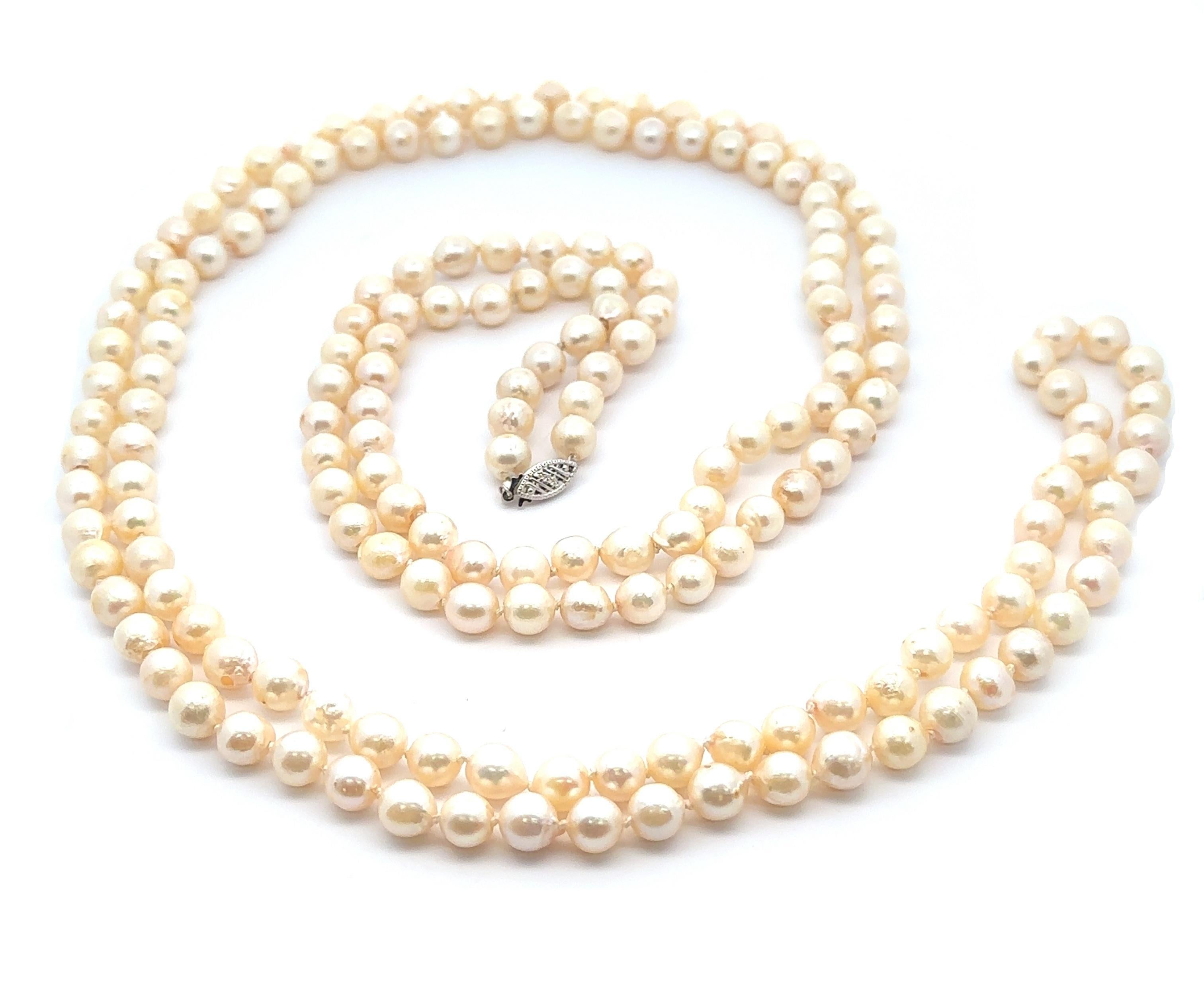 --Stone(s):--
Numerous Genuine Cultured Pearls - Slightly Off Round Shape - Creamy White Color - 6.8-7.6mm (approx.)

Material: Solid 14k White Gold
Weight: 98.90 Grams Gross
Type: Long Strand Cultured Pearl Necklace
Length: 60 Inches
Clasp: Hook