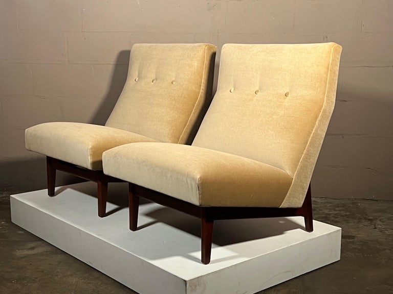 A pair of classic slipper or armless chairs by Jens Risom-original, vintage 1950's production. Walnut frames have a beautiful patina, newly reupholstered in beige velvet. These chairs are comfortable and stylish.