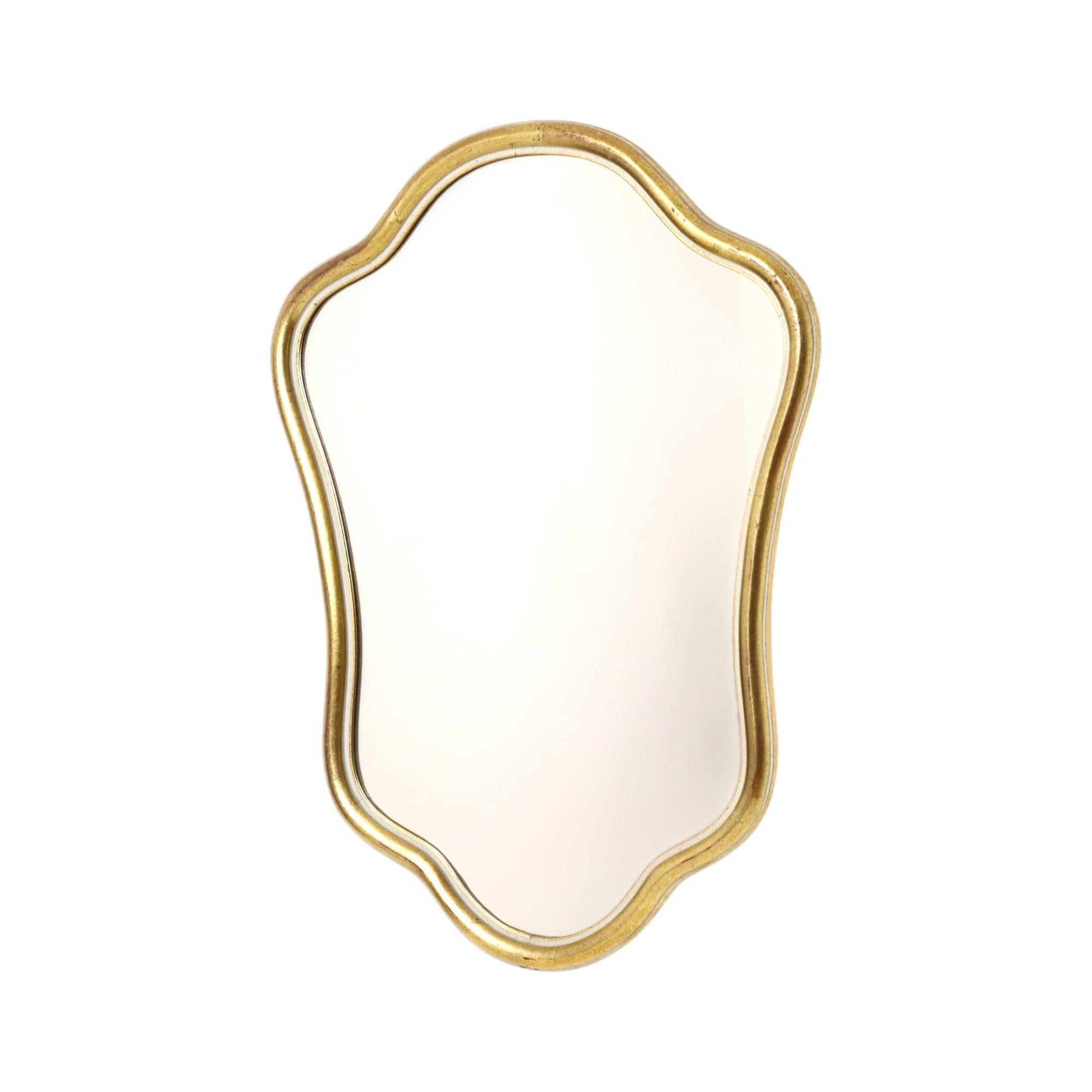 Vintage baroque style mirror in classic gold leaf gilded frame made of wood, graceful mirror with elegant frame decorated with a white border on the inside and outside, marked Cavos Belgium on the back, ca 1960s.

This nice mirror is in very good