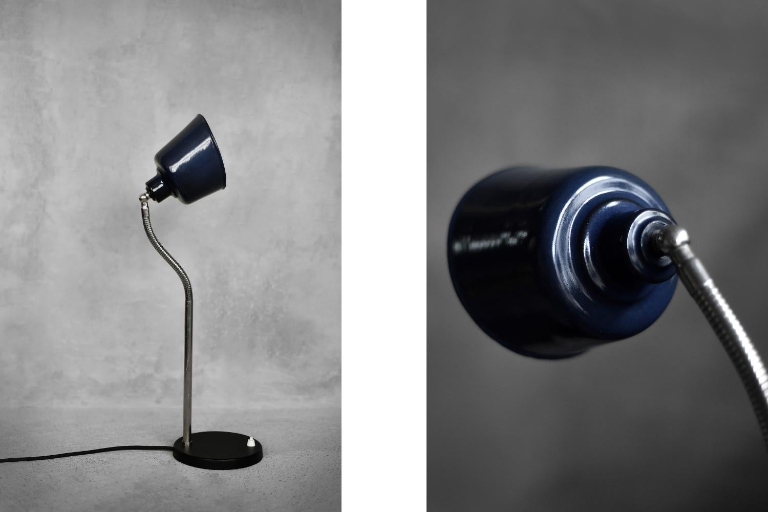 This classic desk lamp was produced in Poland during the 1950s. The lamp has a solid base made of cast iron, varnished black. A flexible, chrome-plated arm, the so-called 