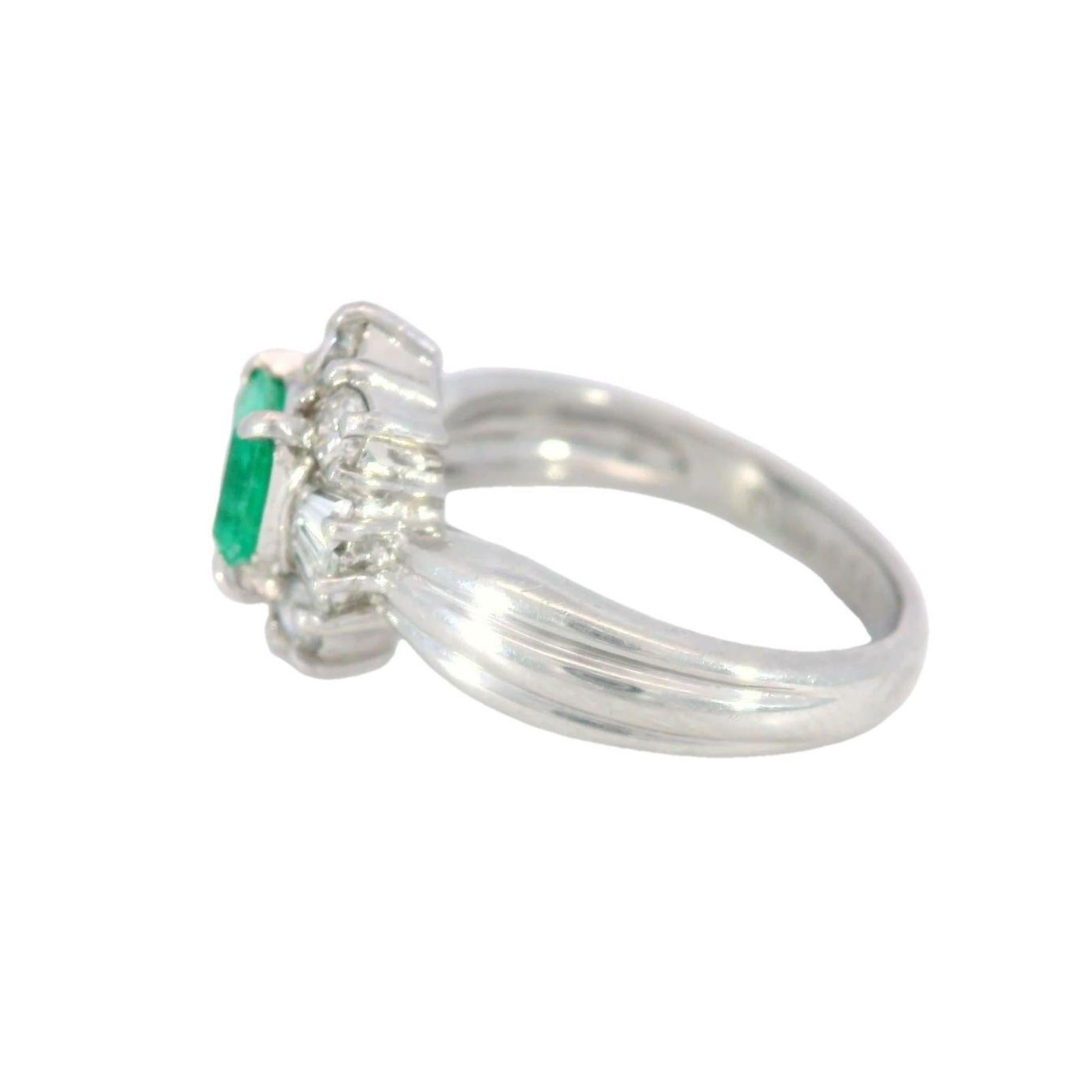 Vintage Classic Platinum Emerald and Diamond Cluster Ring 1.07ctw

This Emerald and Diamond Cluster Ring is a testament to timeless elegance, crafted in platinum during the 20th century. At its center is a vivid emerald-cut emerald, weighing