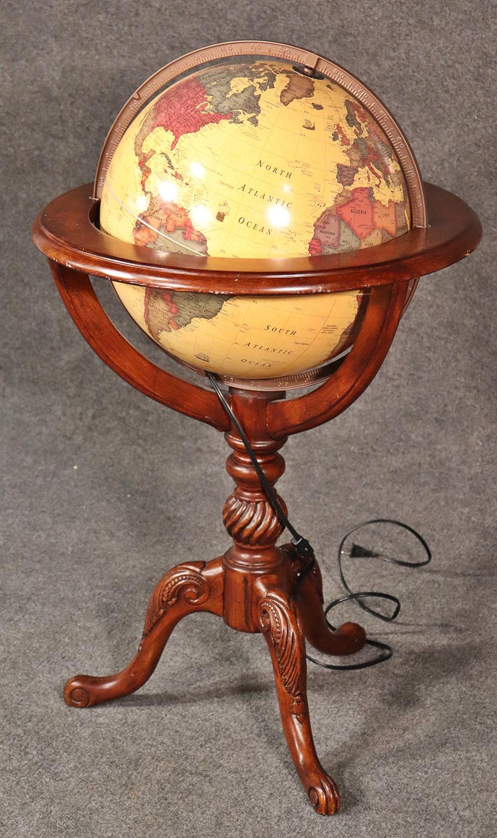 Vintage Glassica lighted French style world globe on a walnut base by George F. Cram.