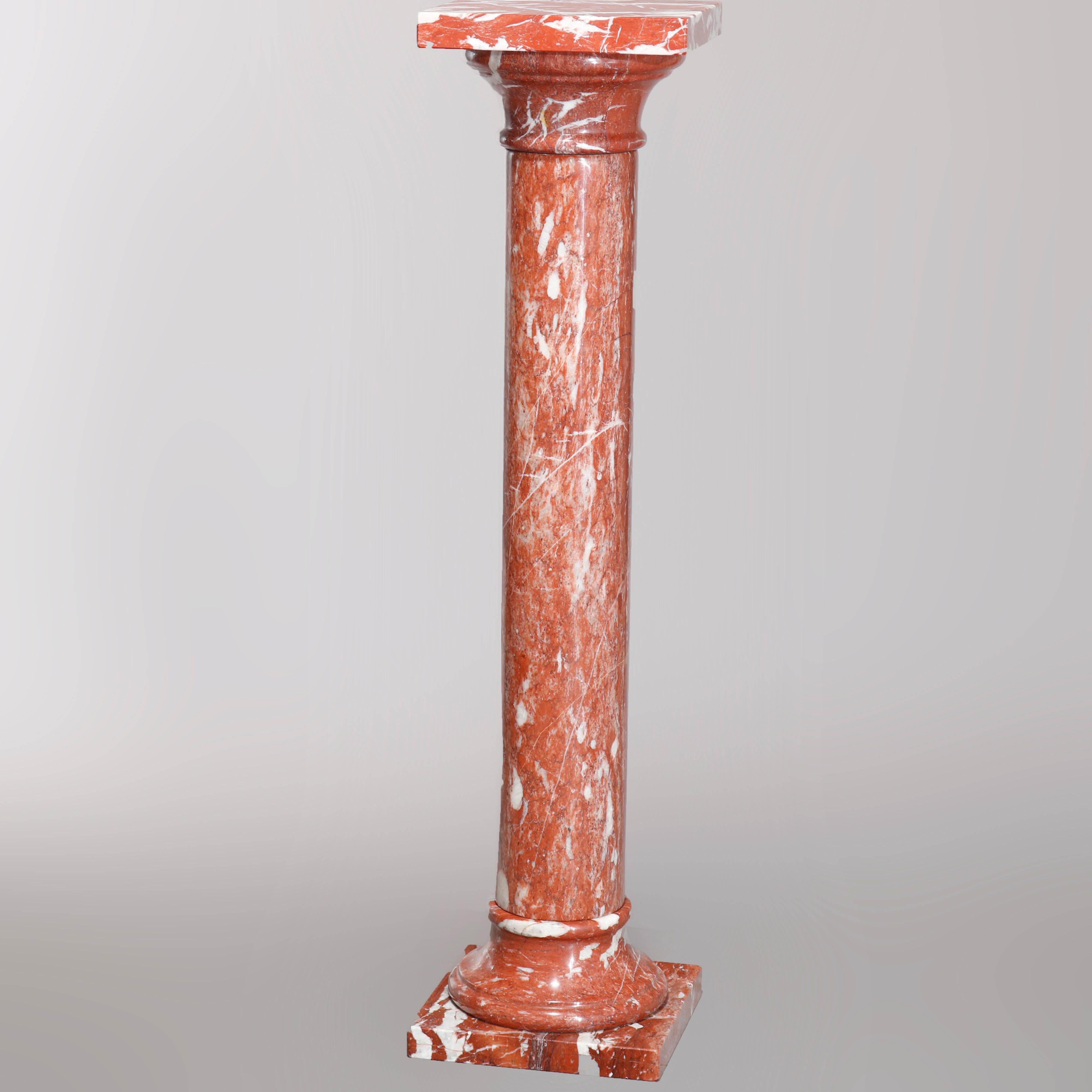 A vintage Classical sculpture display pedestal offers deeply veined rouge marble construction in Greek Doric Column form, 20th century.

Measures: 40.5