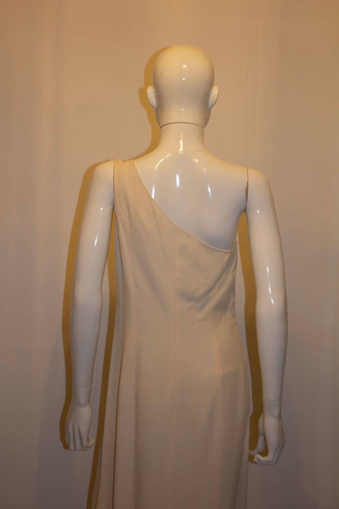 A chic and edgy vintage crepe dress by Claude Montana. The dress has one shoulder, is fully lined and has a 25' slit at the front.  Made in Italy, size 42/8.
Measurements: Bust 36/7, length 54''