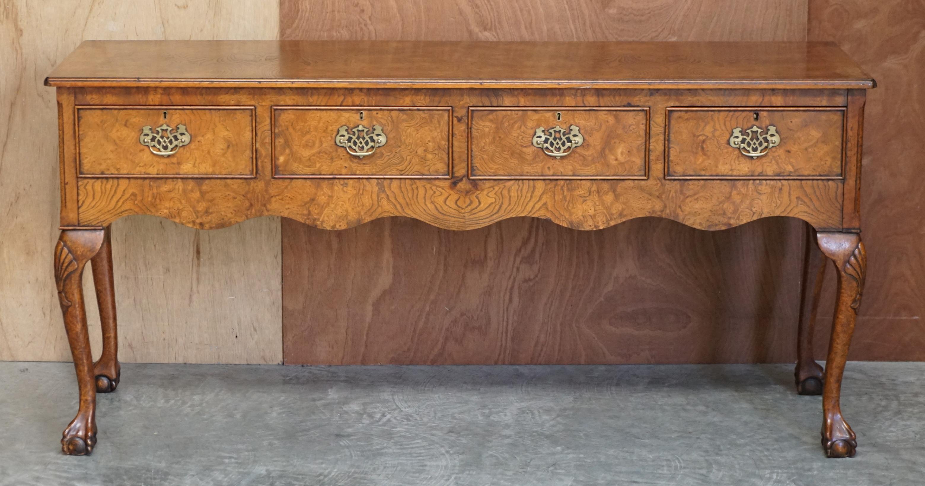 We are delighted to offer for sale this stunning vintage Burr Elm four drawer sideboard with oversized Claw & Ball feet 

A very good looking and well made heavily burred Elm sideboard or large console table, this piece looks expensive and