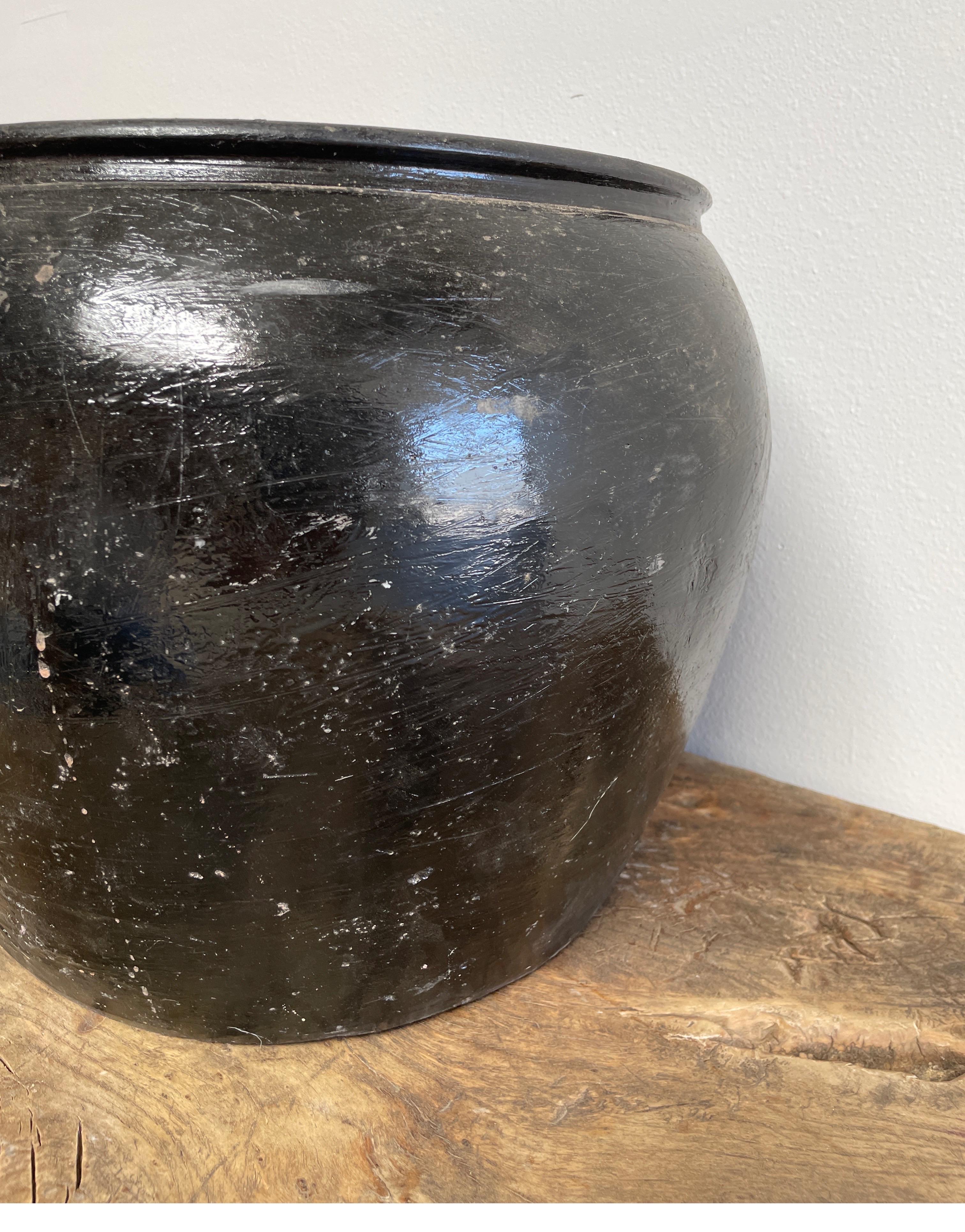 Vintage Pottery

Beautiful and rich in character, this vintage glazed oil pot adds just the right amount of texture + warmth where you need it. Stunning faded black/ brown unglazed finish with warm terra-cotta accents.
Some have a more faded