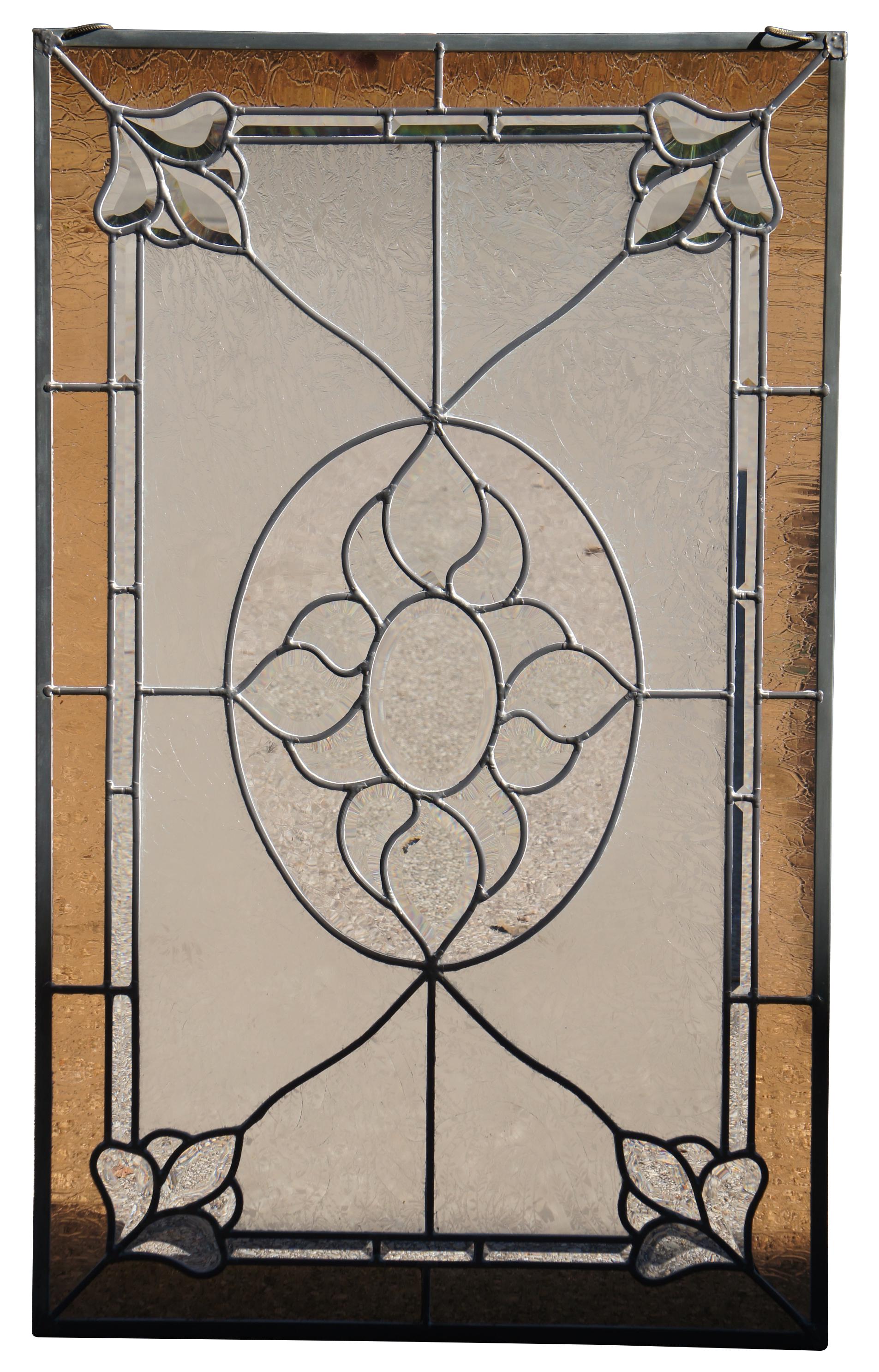 A beautiful textured and beveled leaded stained glass hanging panel.  Features an amber border with pendeloques along the corners leading towards a geometric center.  Elegant and clean lines will bring warmth to any room. 