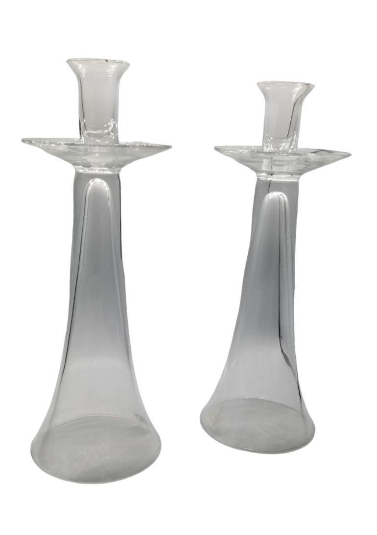 Elevate your ambiance with timeless elegance using these Vintage Clear Crystal Candlestick Holders. Crafted with precision and simplicity, these holders showcase the beauty of clear glass, allowing the warm glow of candlelight to shine through. The
