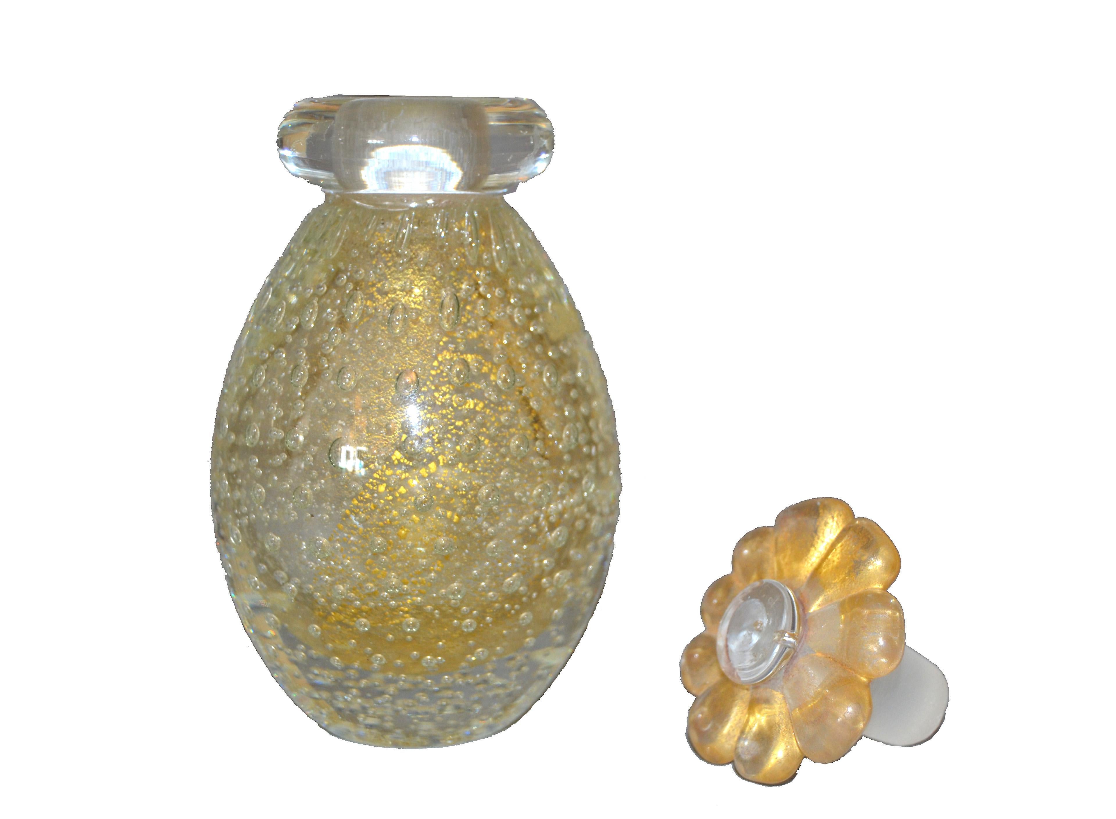 Vintage clear and gold inclusions controlled bubbles Murano art glass perfume bottle with a flower stopper.
Beautiful for your Boudoir.
 