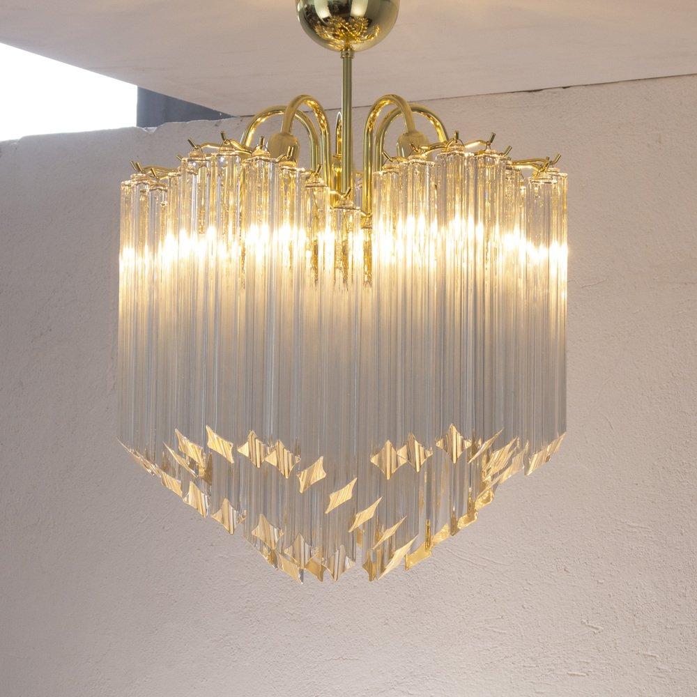 Vintage transparent Murano glass spiral ceiling lamp with brass structure, Made in Italy design light Exceptional Italian chandelier made with gold-plated brass frame and clear Murano glass in the shape of an elongated quadrihedron. 

Additional