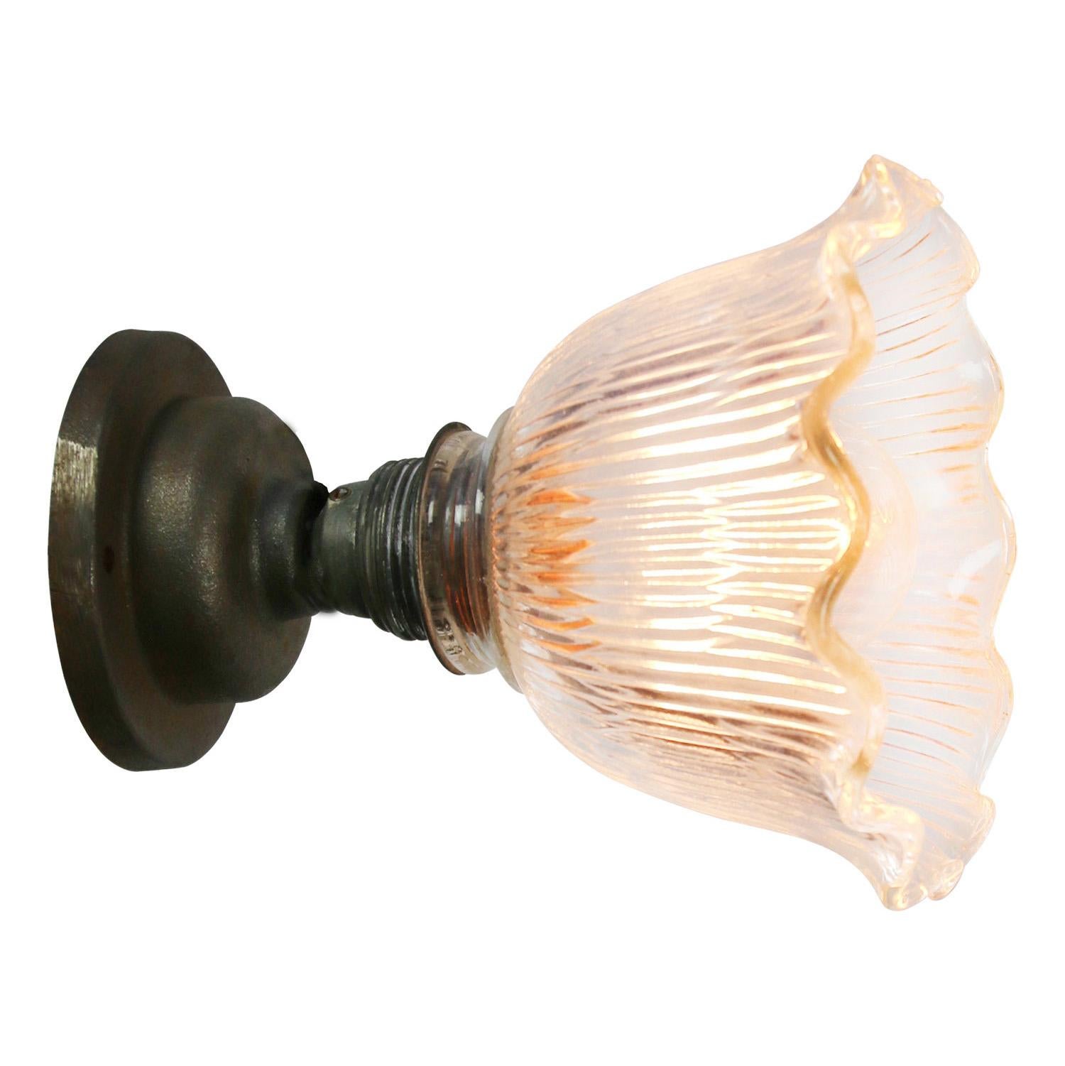 Holophane glass wall light
metal E27 bulb holder with clear striped glass shade
cast iron wall mount diameter 10 cm
wall lamp or ceiling scone

Weight: 1.40 kg / 3.1 lb

Priced per individual item. All lamps have been made suitable by