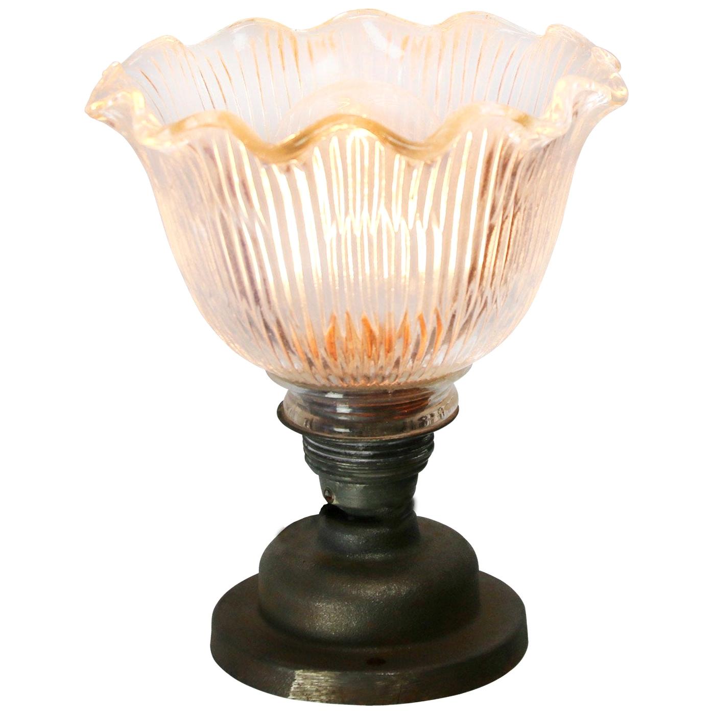 Holophane glass wall light
metal E27 bulb holder with clear striped glass shade
cast iron wall mount diameter 10 cm
wall lamp / ceiling scone

Weight: 1.40 kg / 3.1 lb

Priced per individual item. All lamps have been made suitable by