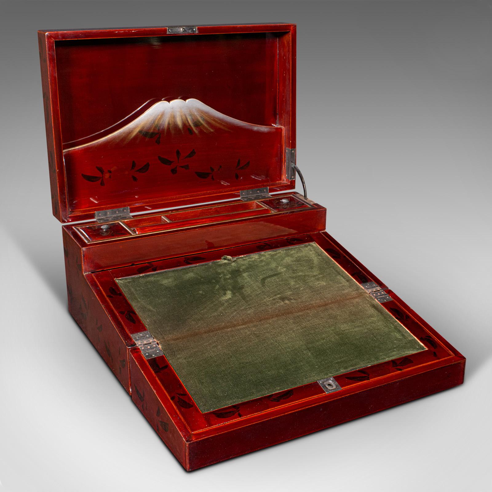 This is a vintage cleric's writing slope. A Japanese, red lacquer travelling correspondence box, dating to the Art Deco period, circa 1930.

Striking writing case with delightful Japanese iconography
Displays a desirable aged patina and in good
