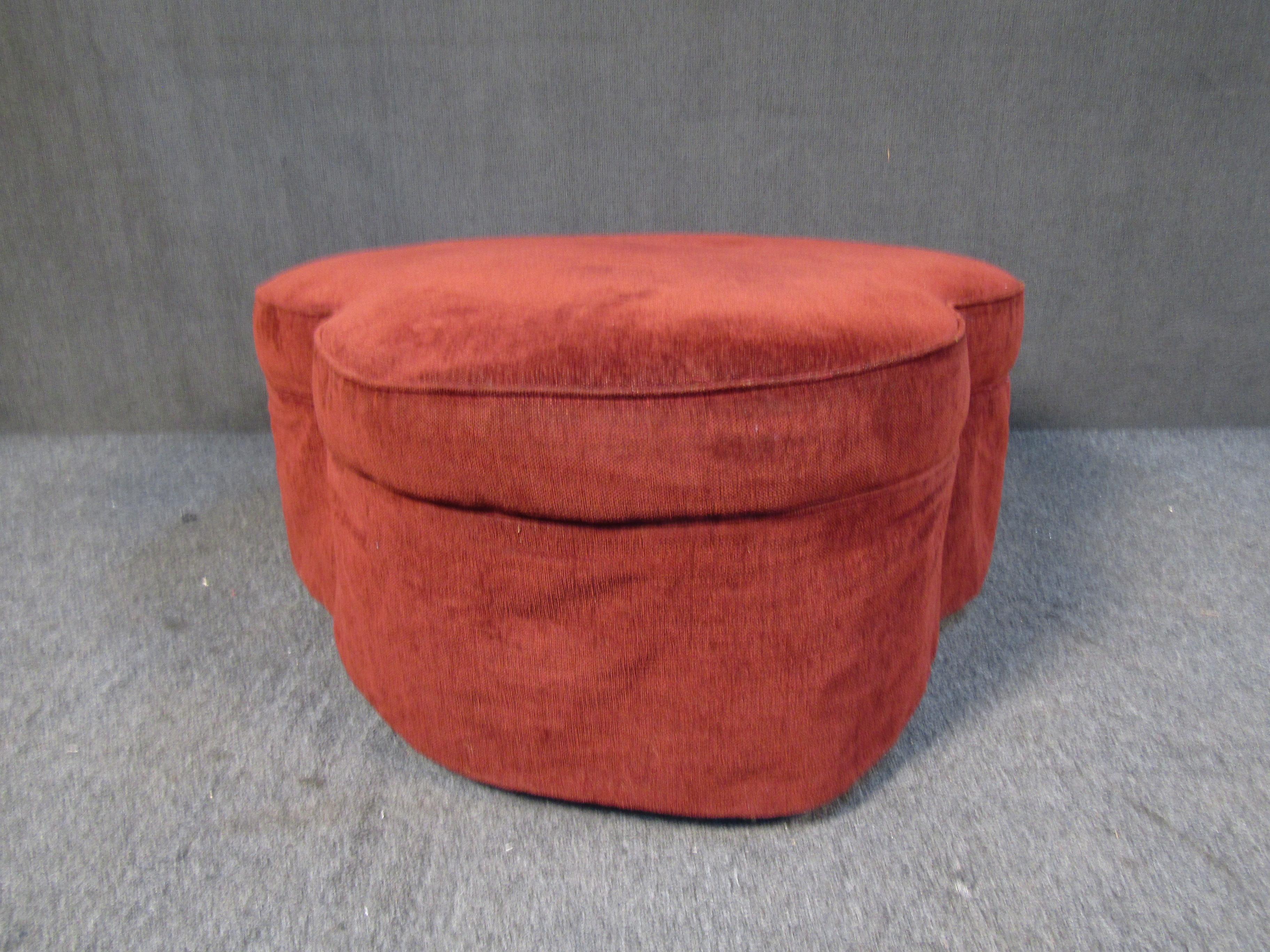 This unique vintage ottoman features a clover shaped design completed by a warm red upholstery. Please confirm item location with seller (NY/NJ).