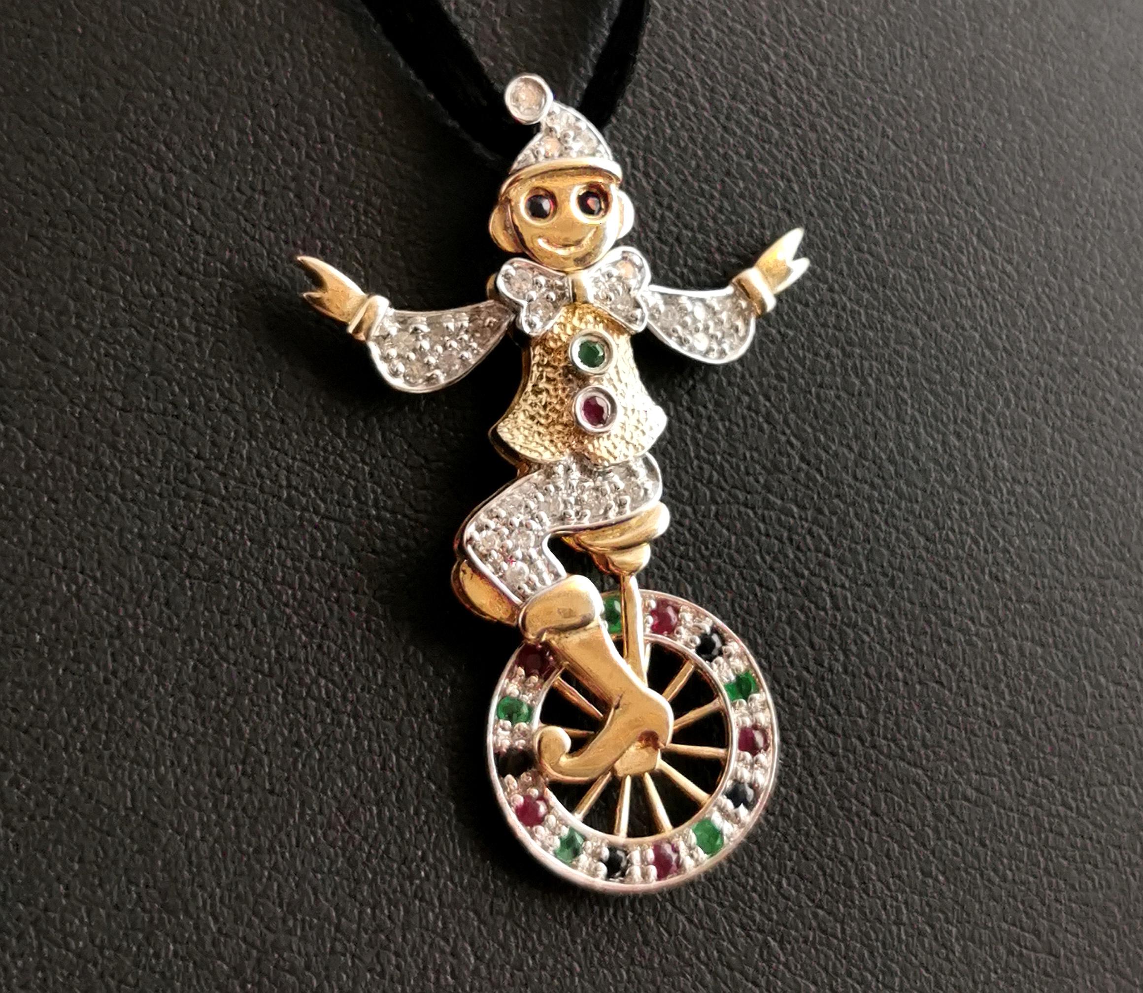 A fun, novelty vintage gemset clown pendant in 9kt gold.

This awesome pendant is loaded with sparkly gems and is a fun and happy piece of jewellery for sure!

It is designed as a clown riding a unicycle and is an articulated pendant with movable