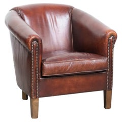 Vintage club chair made of sheepskin leather with decorative nails