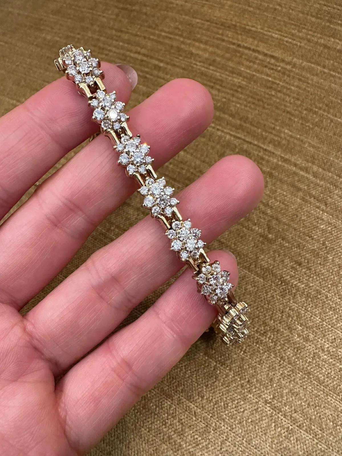 Vintage Cluster Round Diamond Bracelet 6.00 Carat Total Weight in 14k Yellow Gold 

Diamond Bracelet features 15 Diamond Cluster links composed of bright, lively Round Brilliant Diamonds set in 14k Yellow Gold. The bracelet is secured by a tongue