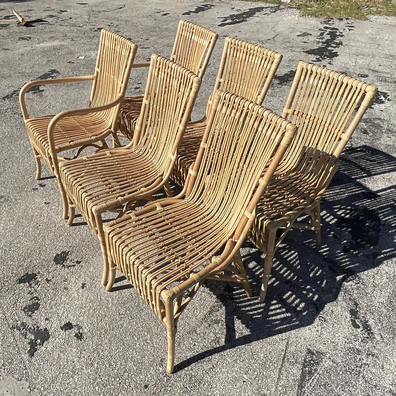 A fabulous set of 6 vintage Coastal dining chairs. Made by the iconic Amanda Lindroth. Beautiful stick rattan in a chic slope design. Acquired from a Palm Beach estate.

Arm chair dimensions 20.75 W.