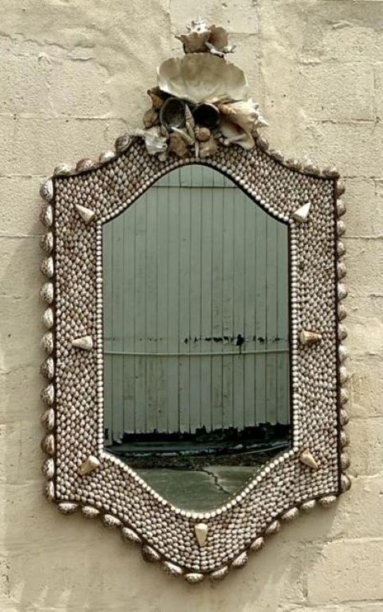 Monumental vintage coastal mirror by Anthony Redmile, adorned with intricate shell details. A statement piece of seaside elegance.