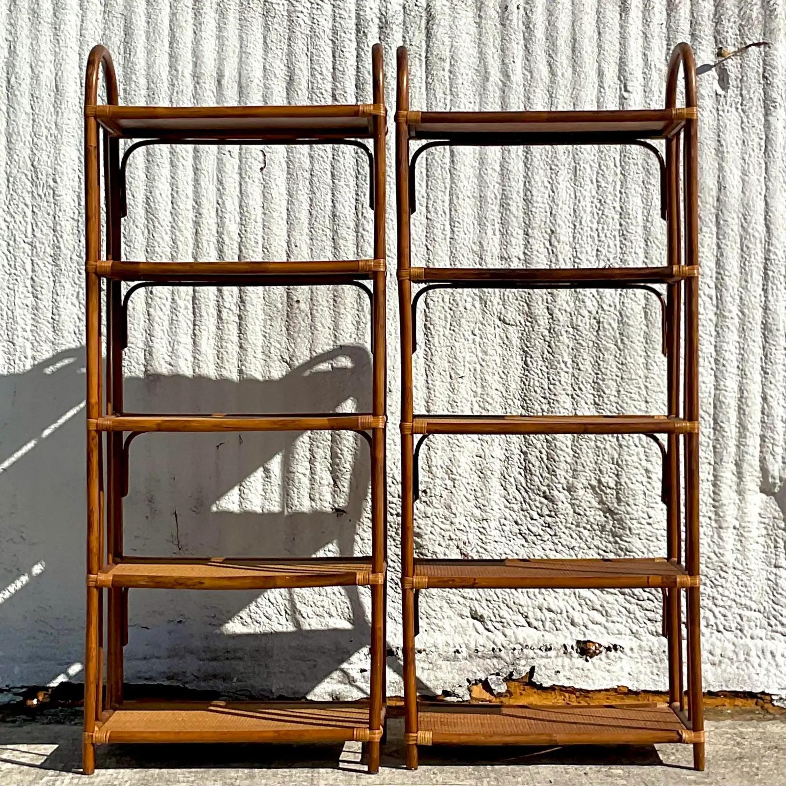 A fantastic pair of vintage Coastal Etagere. Beautiful arched rattan with inset woven rattan panels. Acquired from a Palm Beach estate.
