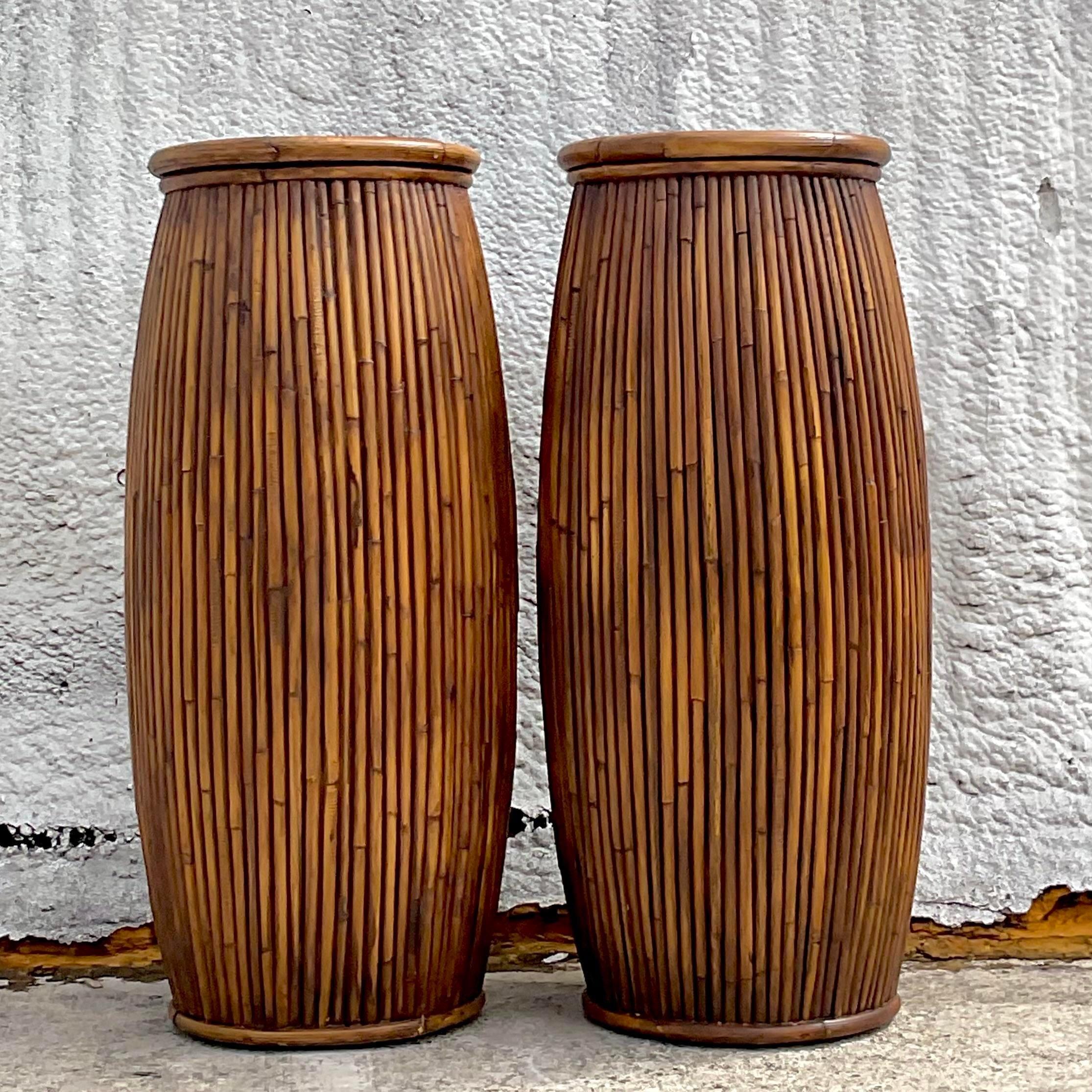 A Stunning pair of vintage Coastal pedestals. Made by the iconic Milling Road Baker group. Gorgeous pencil reed construction in a clean and simple design. Acquired from a Palm Beach estate.