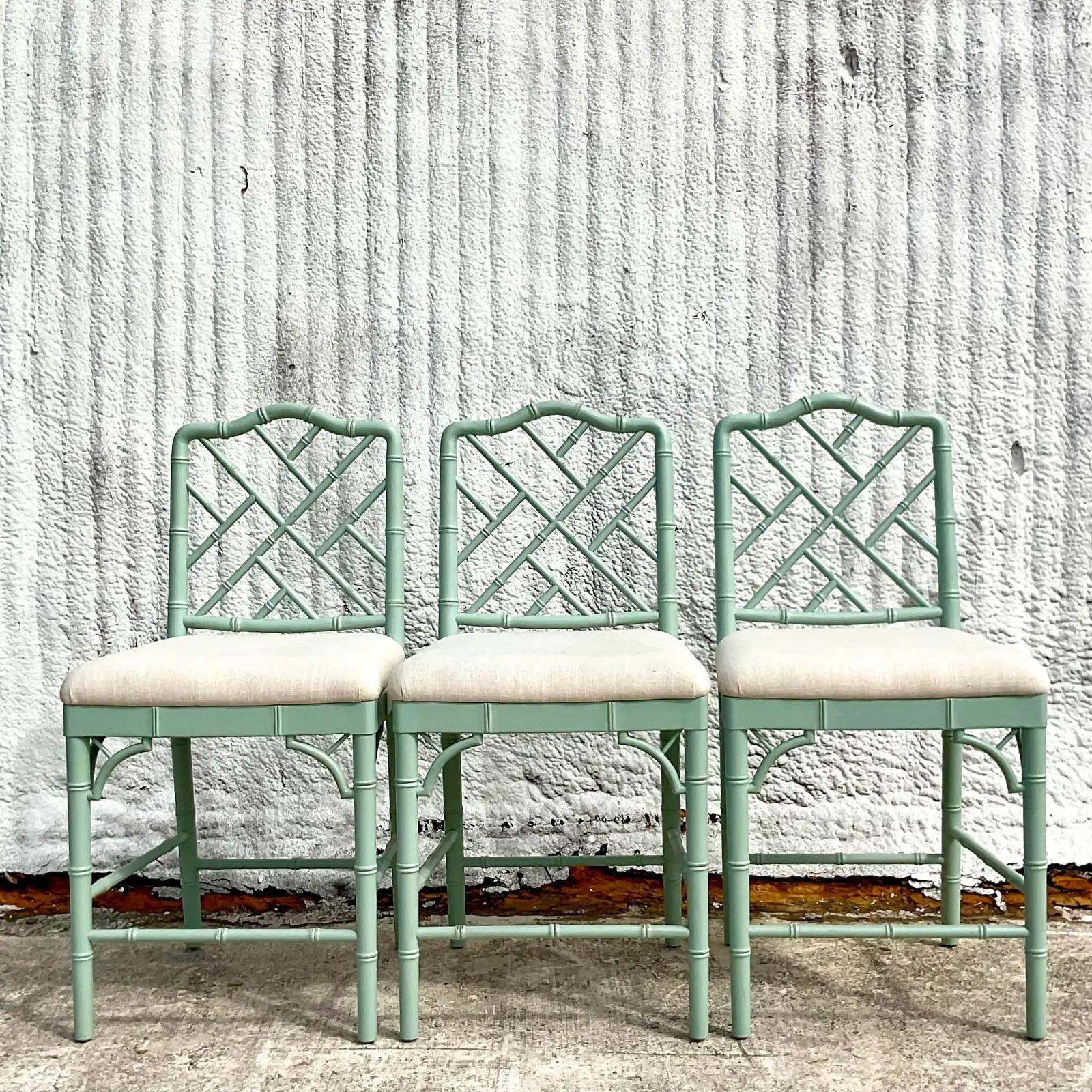 A chic set of three vintage Coastal bar stools. The classic Dayna barstools from Ballard Designs. A beautiful pale green in a matte finish. Acquired from a Palm Beach estate.