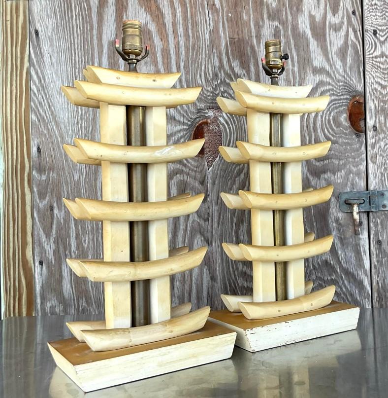 Fabulous vintage Coastal rattan lamps. A beautiful abstract pagoda design. Acquired from a Palm Beach estate.
