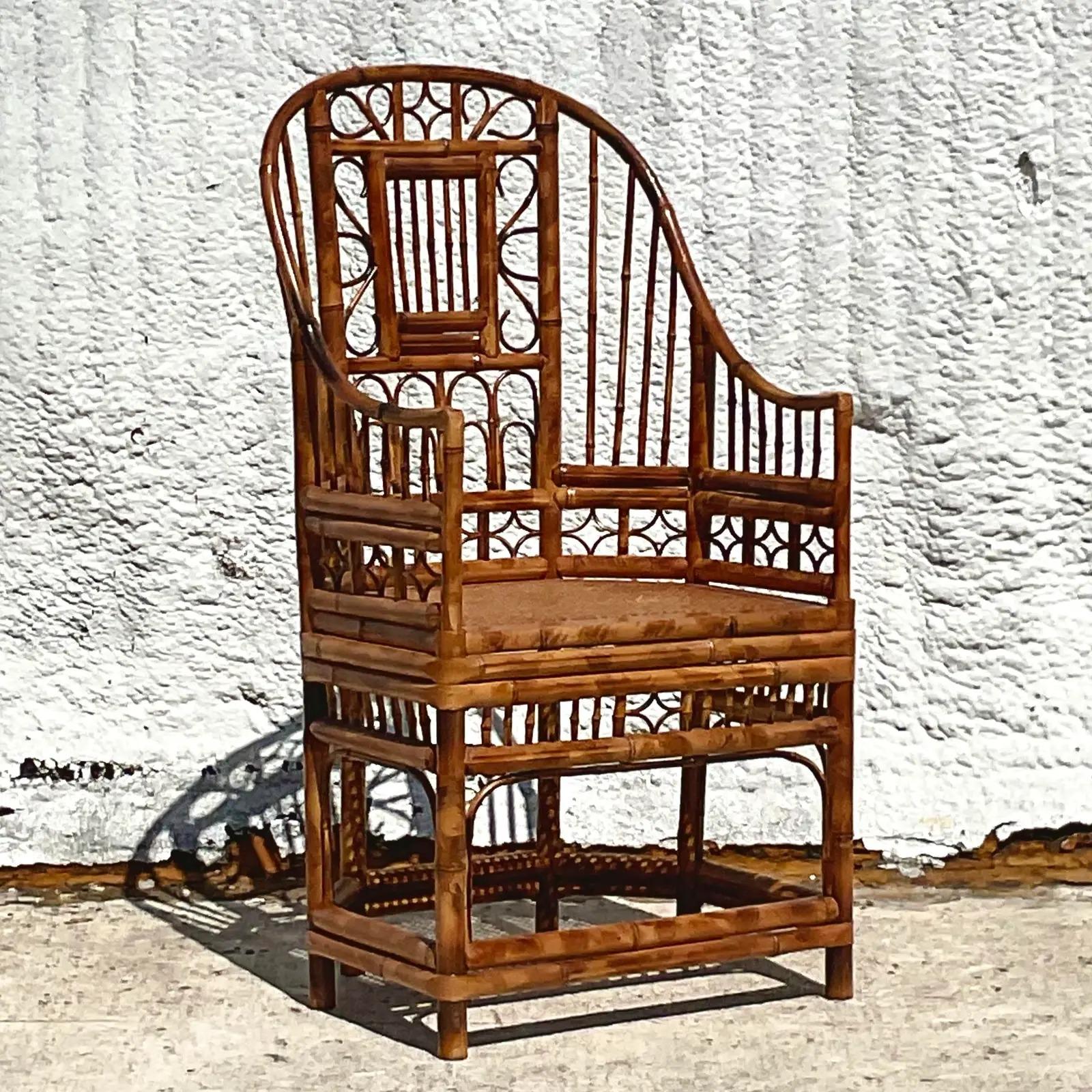 A fantastic vintage Coastal chair. The coveted Brighton Pavilion chair. Beautiful fretwork details with inset cane seat. Acquired from a Palm Beach estate.