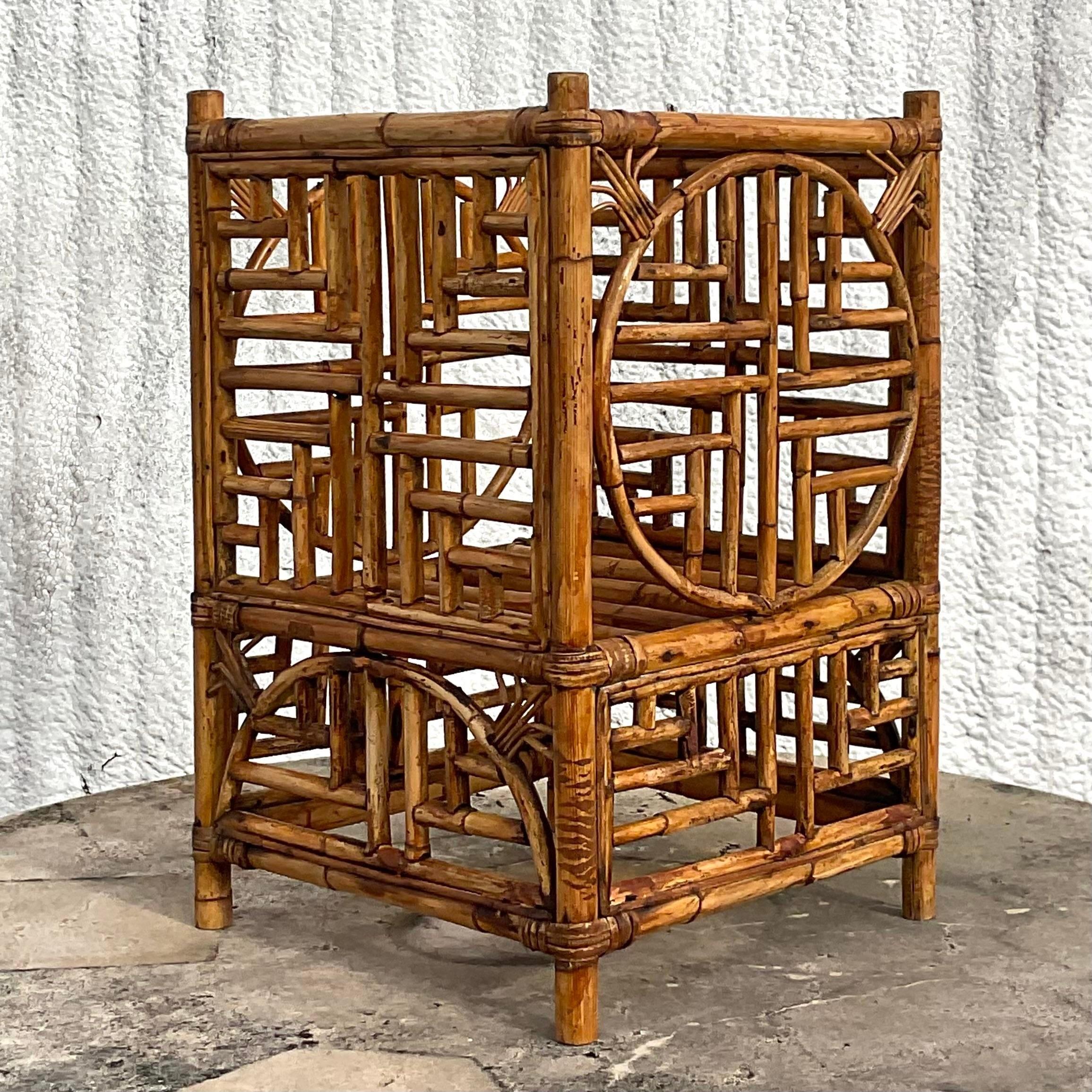 A fabulous vintage Coastal bamboo plant stand. A chic fretwork medallion design in tortoise shell bamboo. Acquired from a Palm Beach estate.