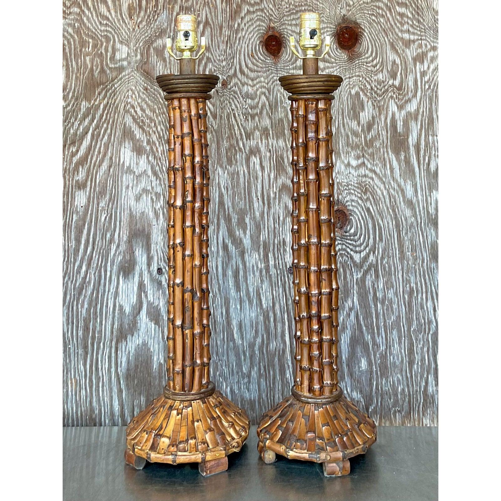 Bring a touch of natural elegance into your space with this stunning pair of vintage coastal bamboo lamps. Handcrafted with intricate bamboo detailing from base to column, these sculptural beauties exude island-inspired charm and organic