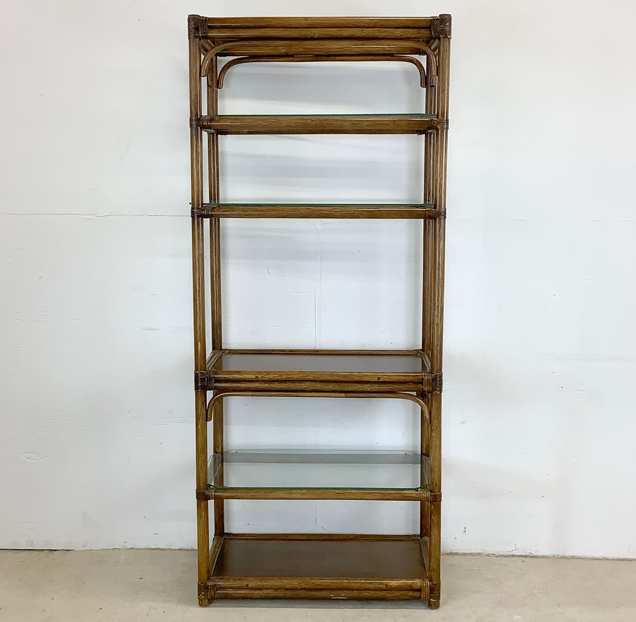 Invite a breath of coastal tranquility into your home with this enchanting faux bamboo shelving unit.  The vintage design of this piece artfully combines the casual elegance of beachfront living with the free-spiritedness of boho chic decor. Its