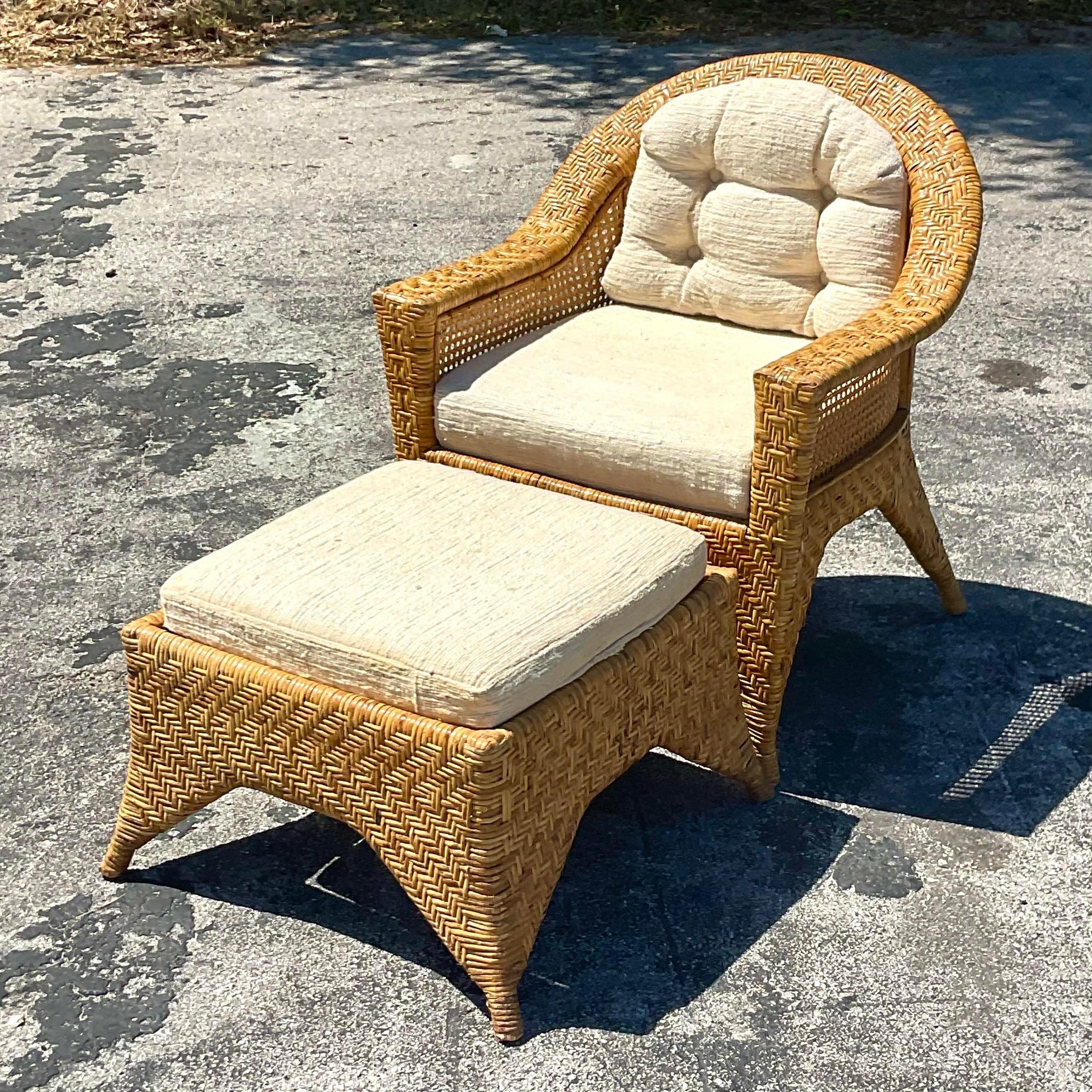A fabulous vintage chair and ottoman set. The set is made with basket weave which adds to their coastal style. Acquired at a Palm Beach estate.

Ottoman dimensions 26.5x26.5x 16.5.