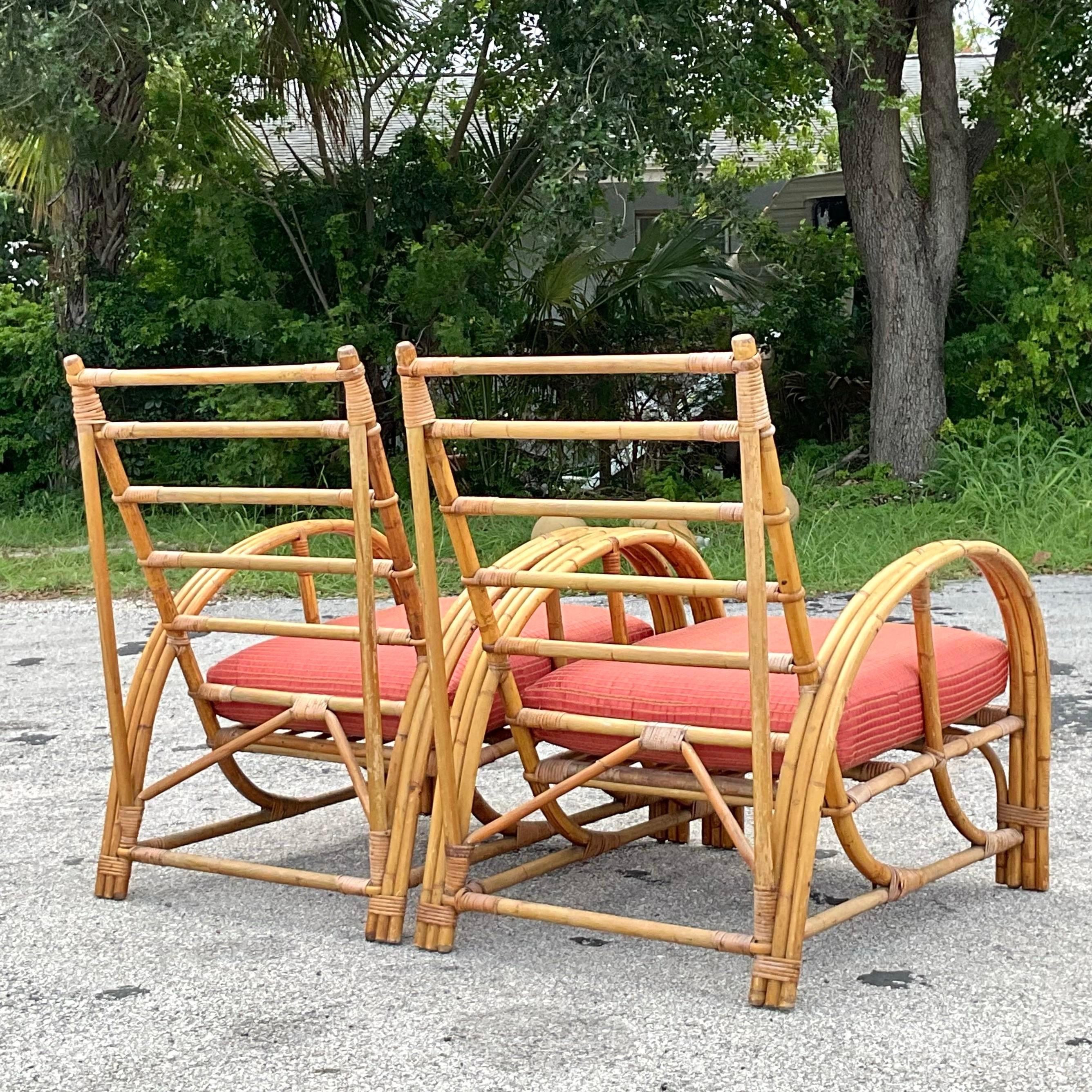 Bring coastal charm to your seating area with this pair of American-style Vintage Bent Bamboo Arch Lounge Chairs. These chairs feature gracefully arched frames and intricate bamboo construction, blending relaxed coastal vibes with timeless vintage