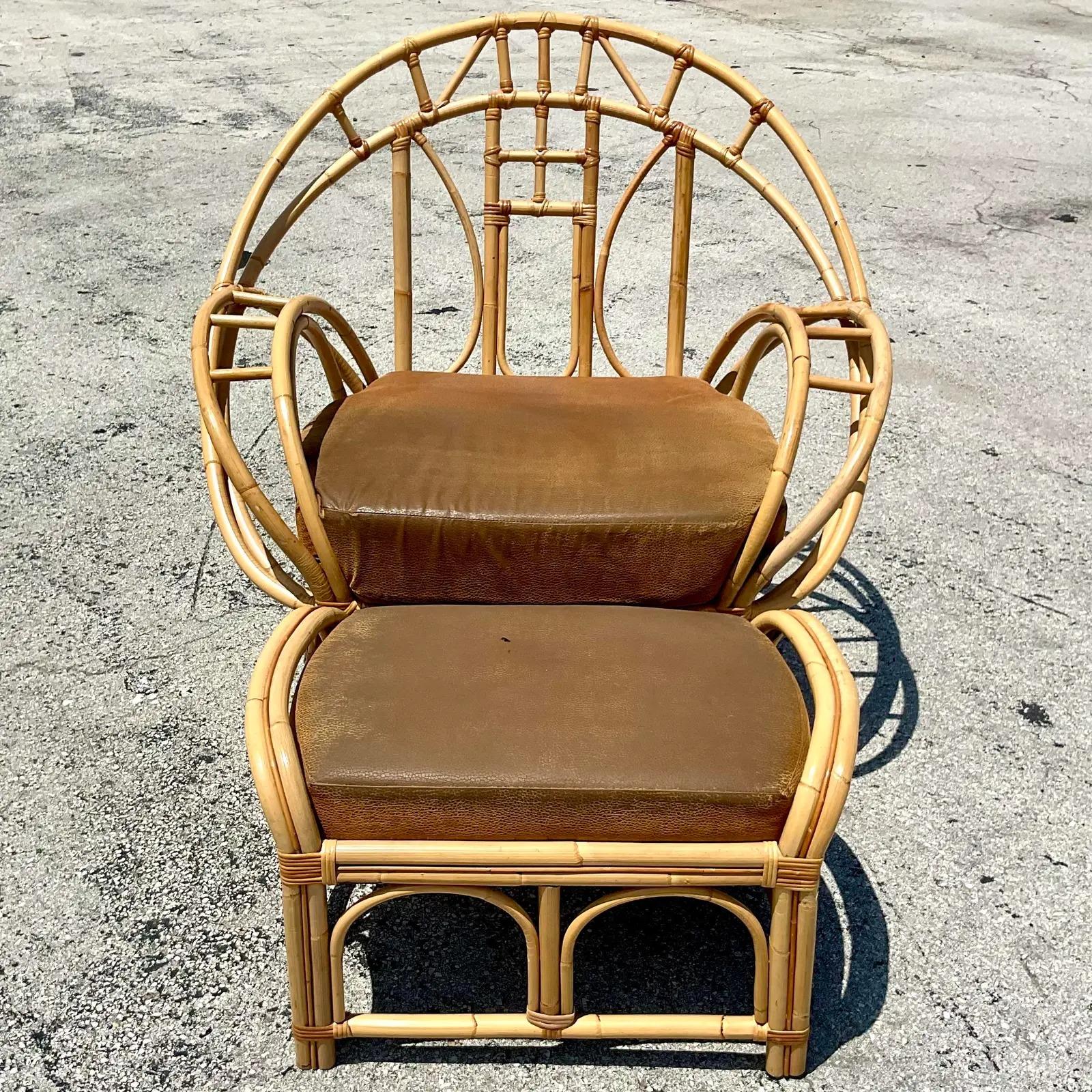 Fantastic vintage Coastal lounge chair and ottoman. Made in the manner of the iconic McGuire butterfly chair, but larger. Super roomy and comfortable. Upholstered in a faux Nubuck suede. Acquired from a Palm Beach estate.