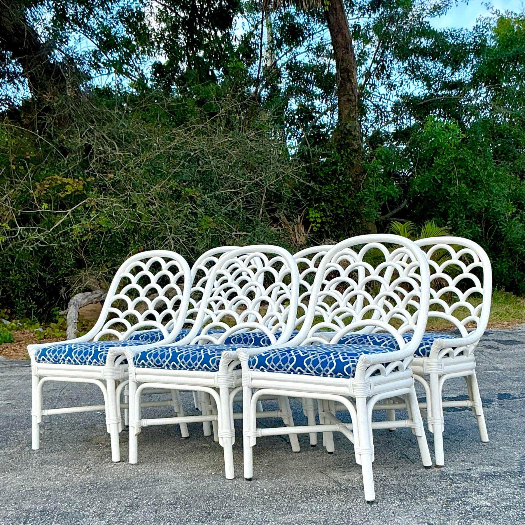 Bring timeless coastal elegance to your dining area with this set of six vintage bent rattan dining chairs. Crafted with graceful curves and natural rattan, these chairs exude a breezy charm that complements coastal, boho, or tropical decor. Their
