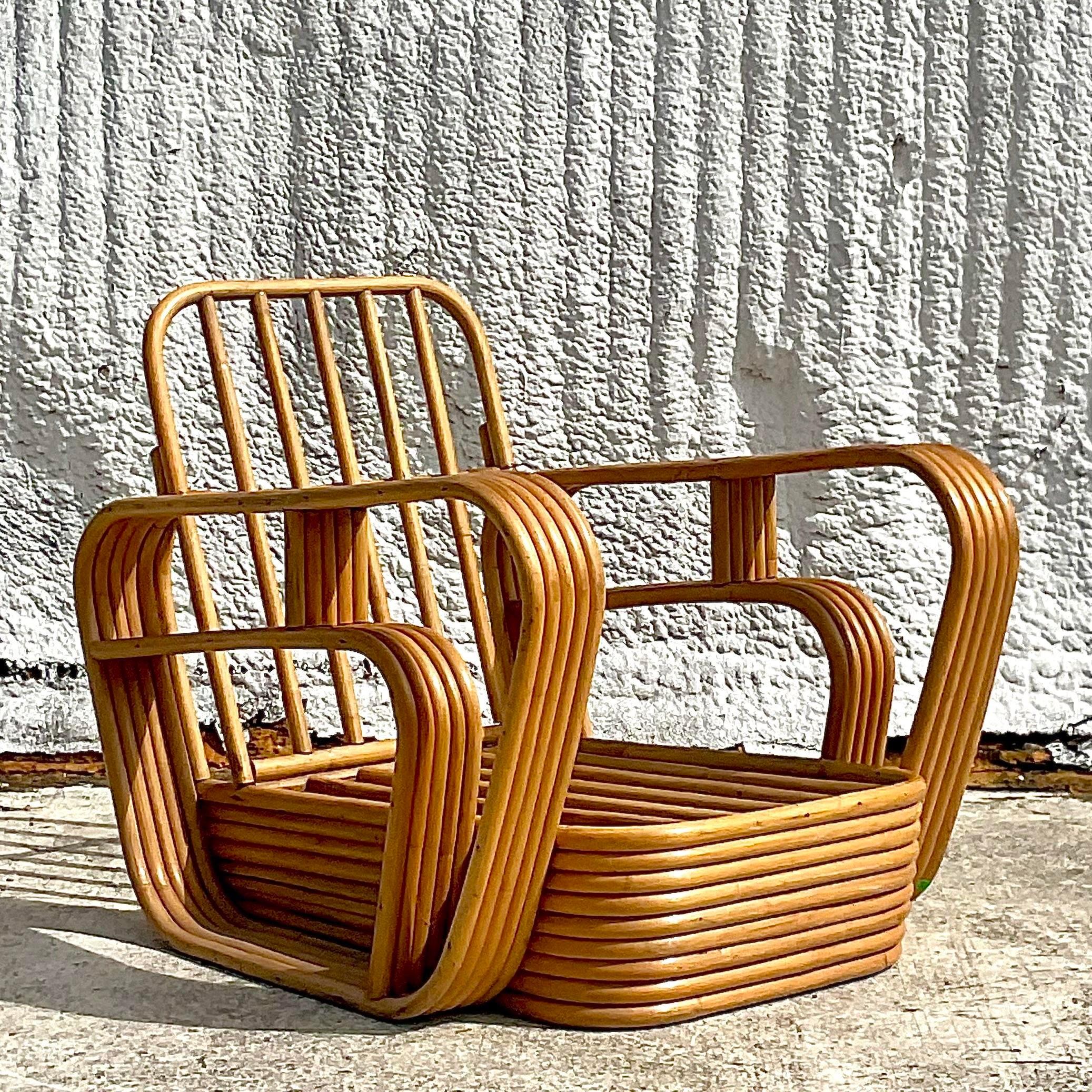 A fantastic vintage Coastal bent rattan lounge chair. Done in the manner of the iconic Paul Frankl with the signature 5 strand design. Acquired from a Palm Beach estate.