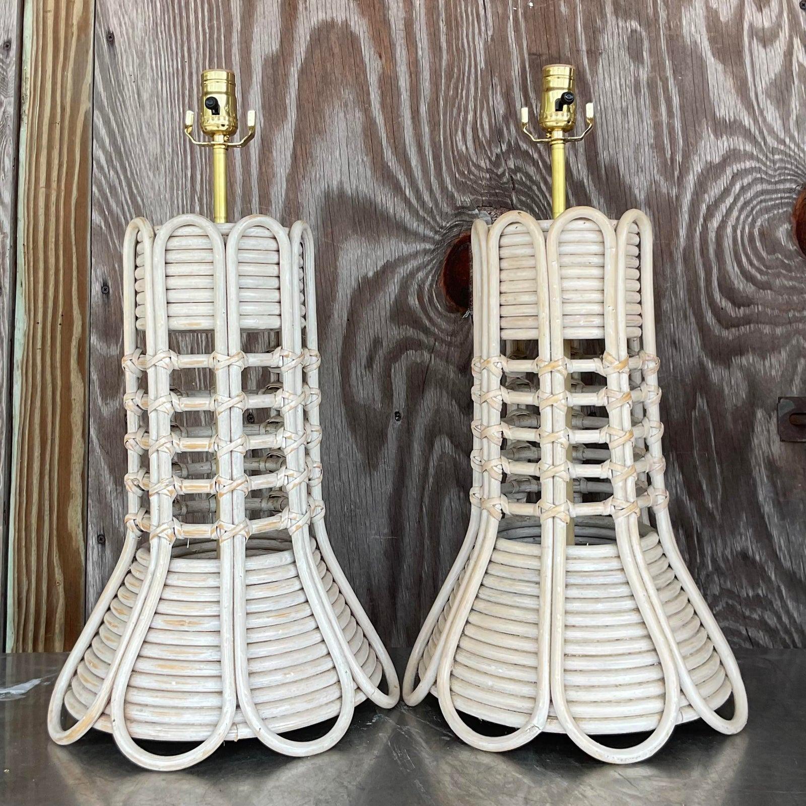 A fabulous pair of vintage Coastal table lamps. Chic bent rattan in an arched design. A cerused neutral finish. Fully restored with all new wiring and hardware. Acquired from a Palm Beach estate.