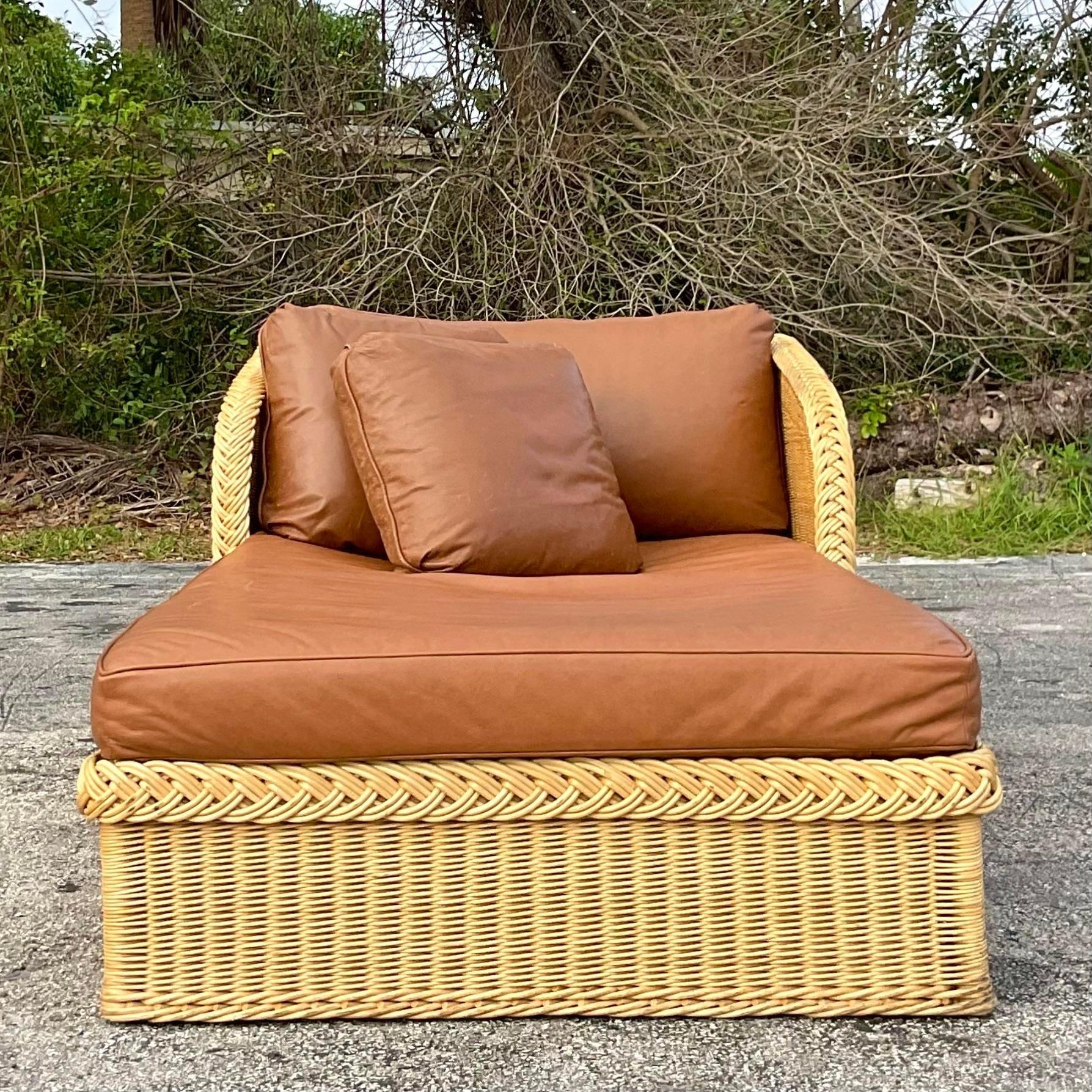 An incredible vintage Coastal chaise lounge. Made by the iconic Bielecky Brothers and tagged below the cushion. A fantastic custom leather cushion with coordinating throw pillows. Acquired from a Palm Beach estate. 