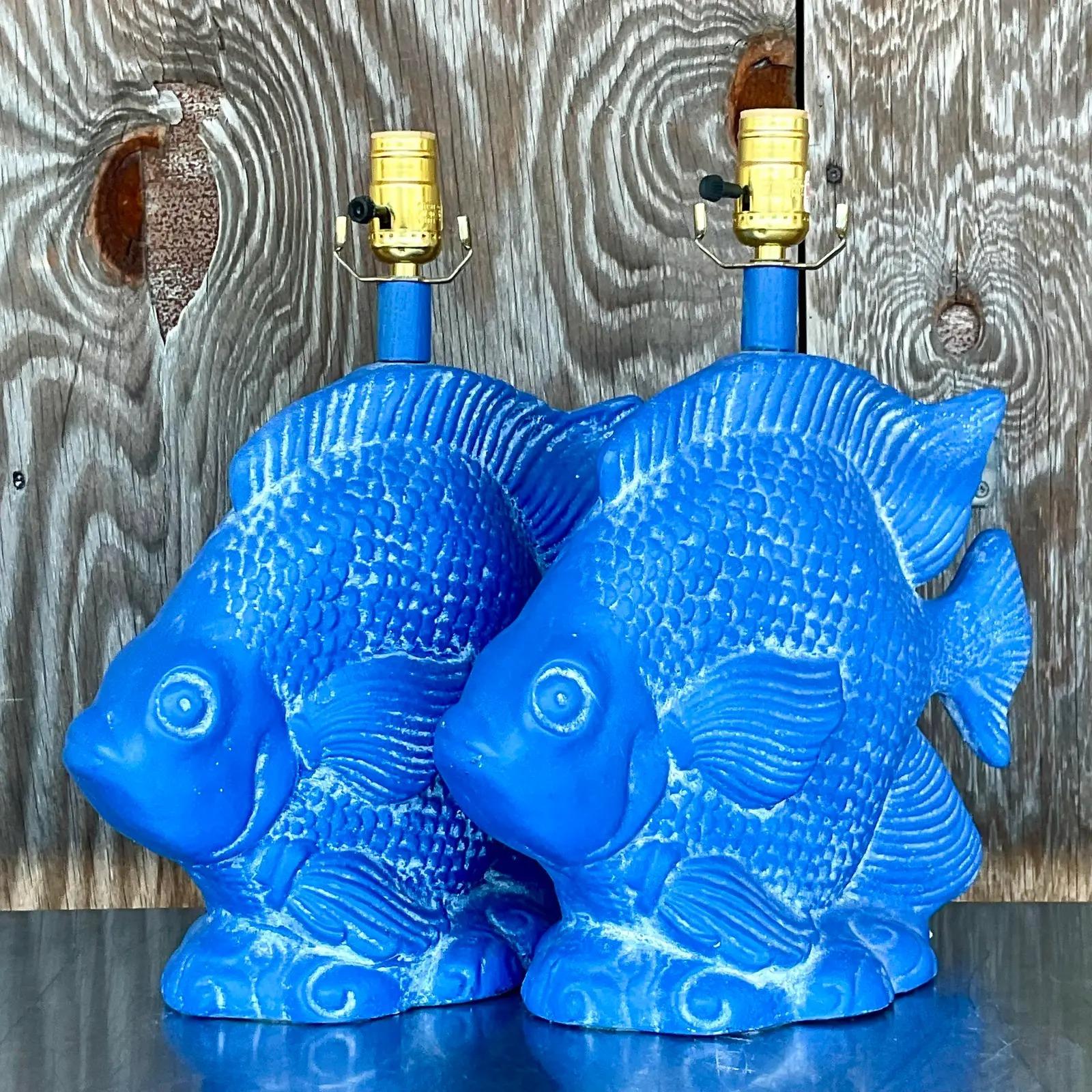 Fabulous pair of vintage Coastal table lamps. A brilliant blue color really makes these lamps a standout. Acquired from a Palm Beach estate.