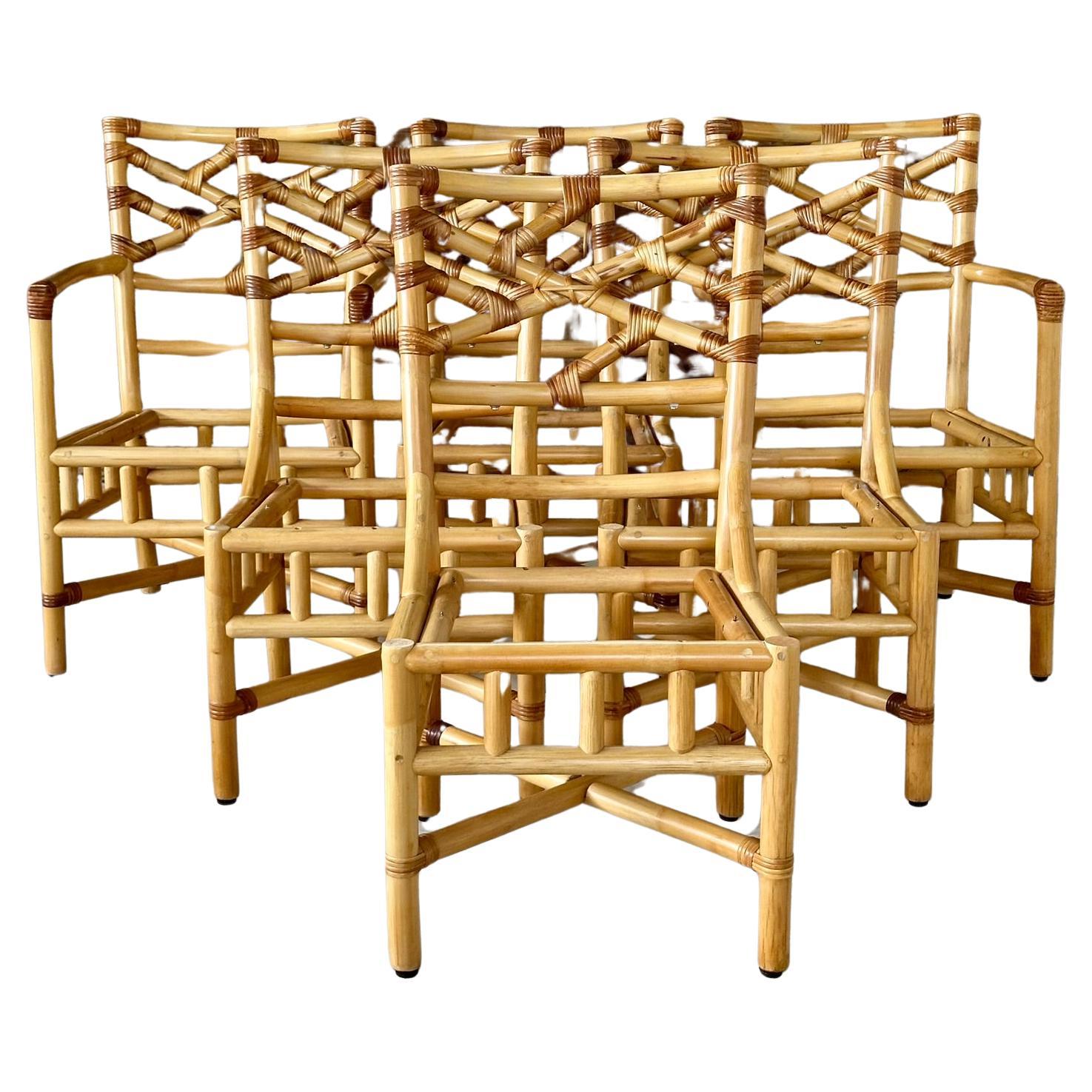 These elegant vintage dining chairs showcase a sophisticated Chippendale style back, expertly crafted from sturdy rattan by Clark Casual Furniture Inc.
Each chair features intricate rattan weaving and a comfortable cushioned seat, perfect for adding