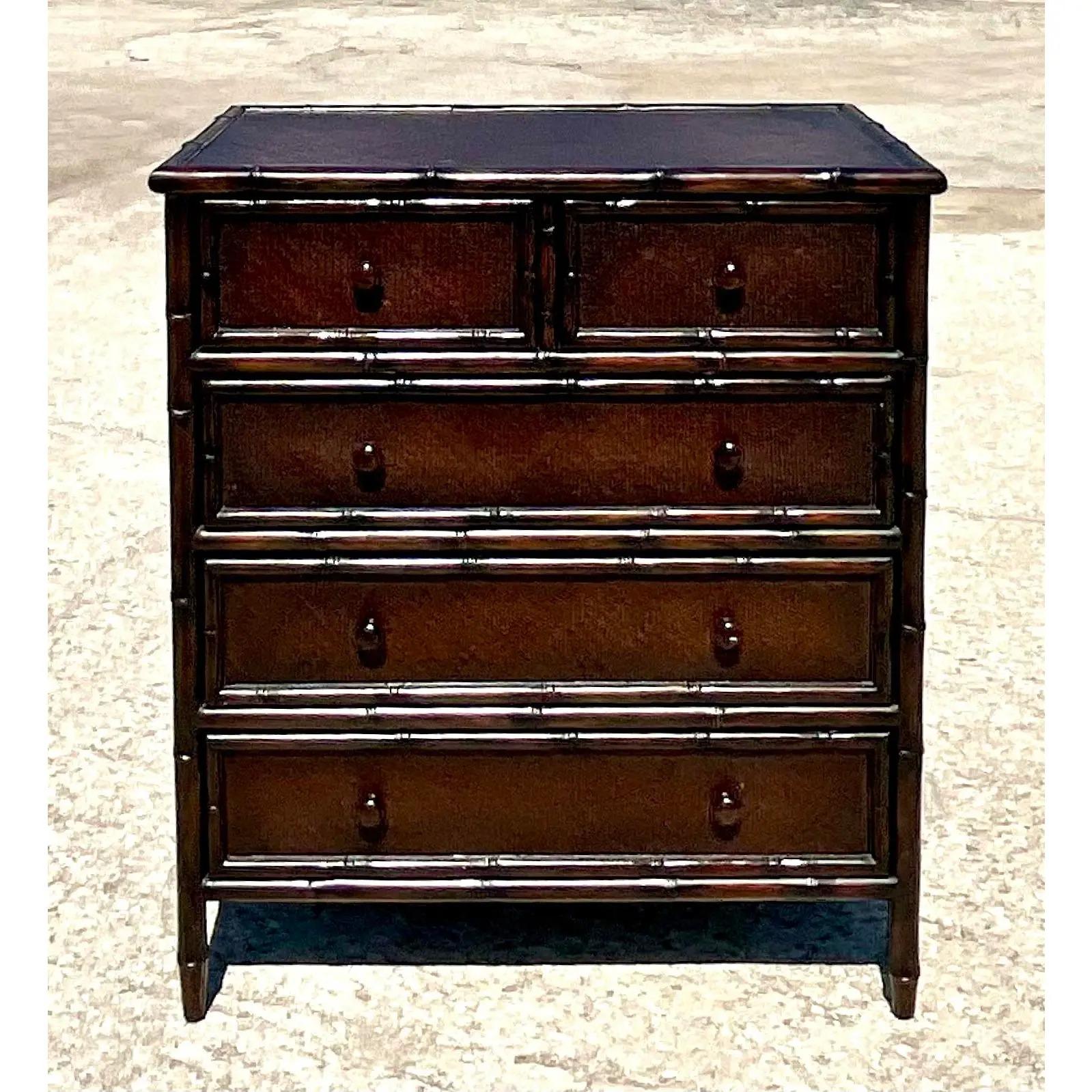 Vintage Coastal Chest of drawers. Beautiful carved dark brown bamboo with inset woven rattan panels. Acquired from a Palm Beach estate.