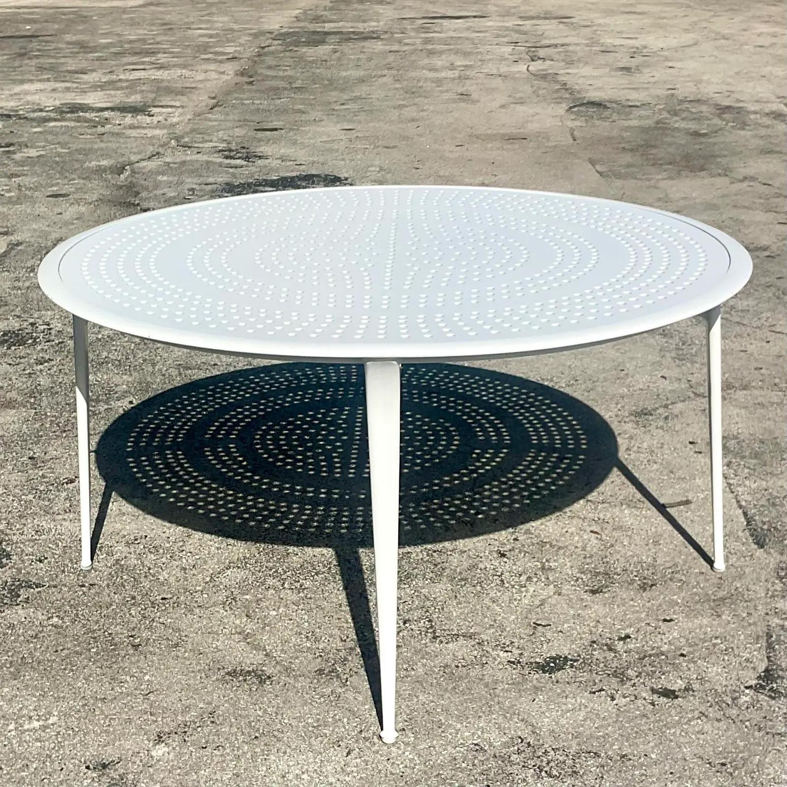 A fantastic vintage coastal dining table. A chic punch cut aluminum in a round shape. Tagged.