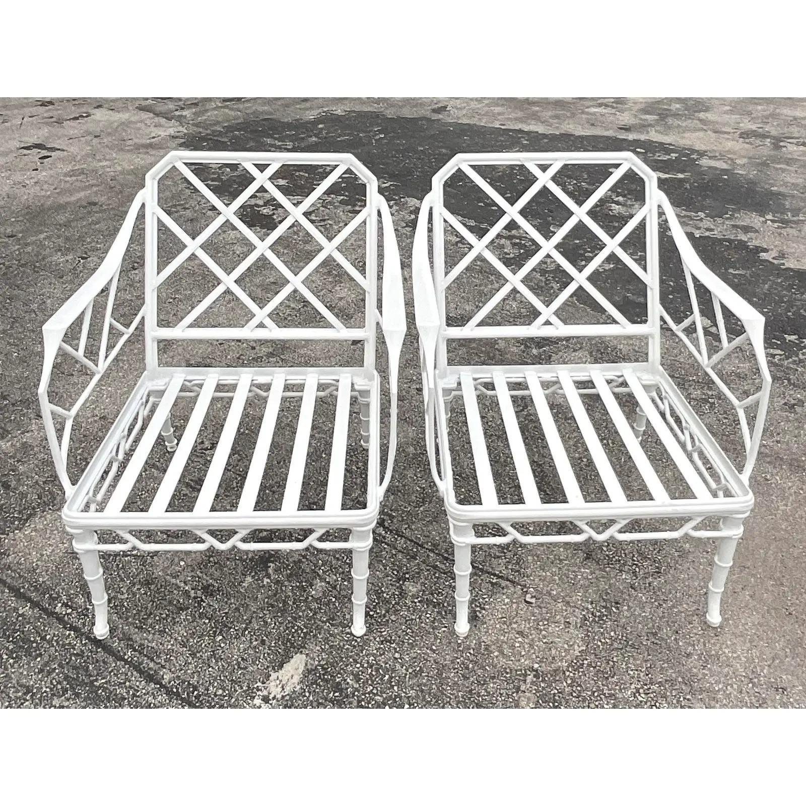 A fantastic pair of vintage Coastal outdoor lounge chairs. Made by the iconic Brown Jordan group in a cast aluminum. Ordered by the designer and never installed. Signed on the back. Acquired from a Palm Beach estate.