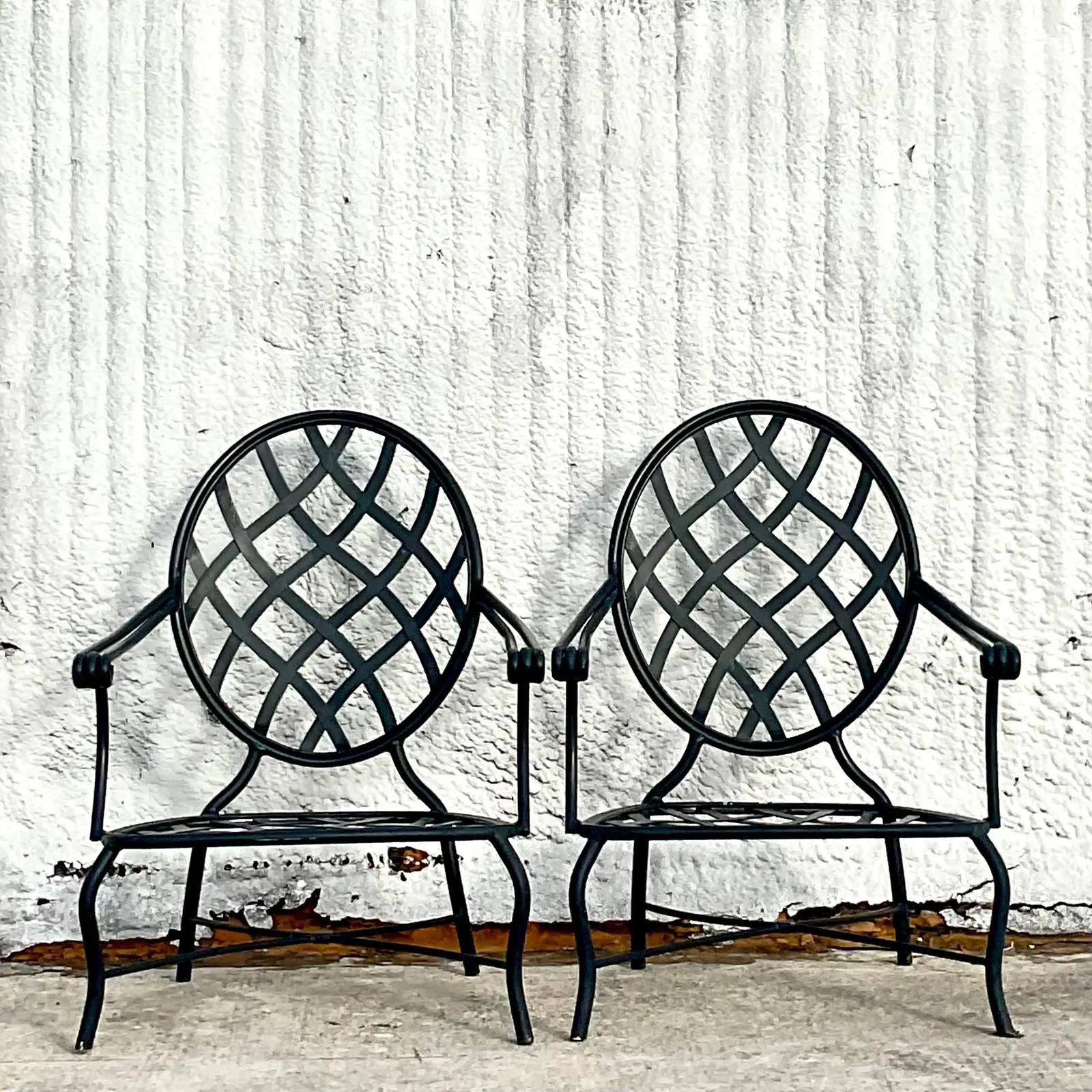 A fabulous pair of vintage Coastal outdoor lounge chairs. Made by the iconic Brown Jordan group. A chic lattice design crafted in aluminum. Tagged. Matching dining chairs also available. Acquired from a Palm Beach estate.
