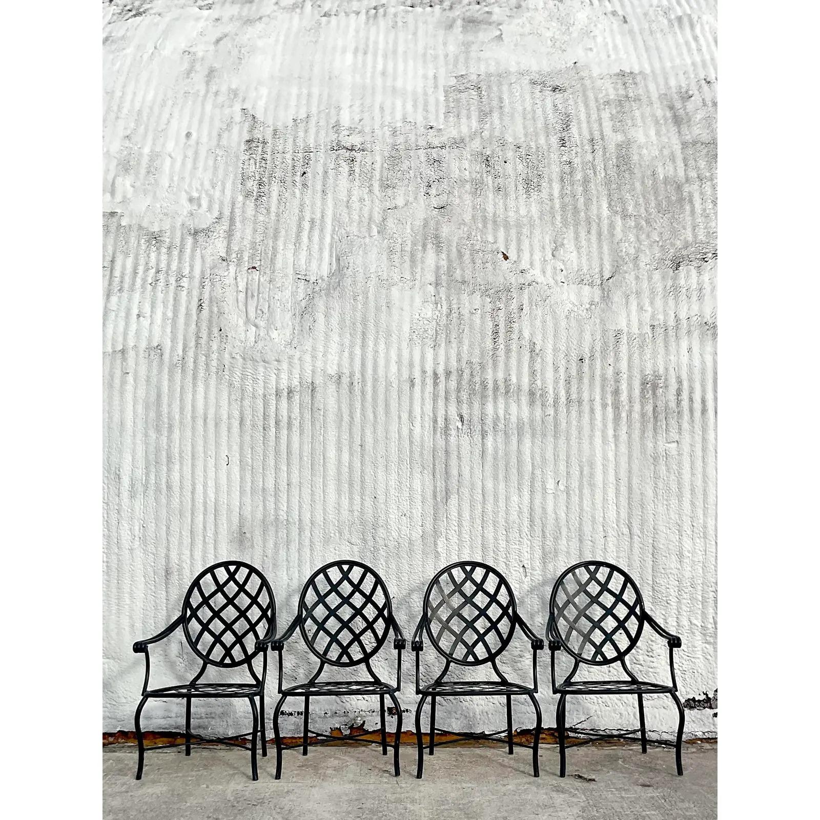 A fabulous set of four vintage Coastal wrought iron dining chairs. Made by the iconic Brown Jordan. Tagged. Acquired from a Palm Beach estate.

 