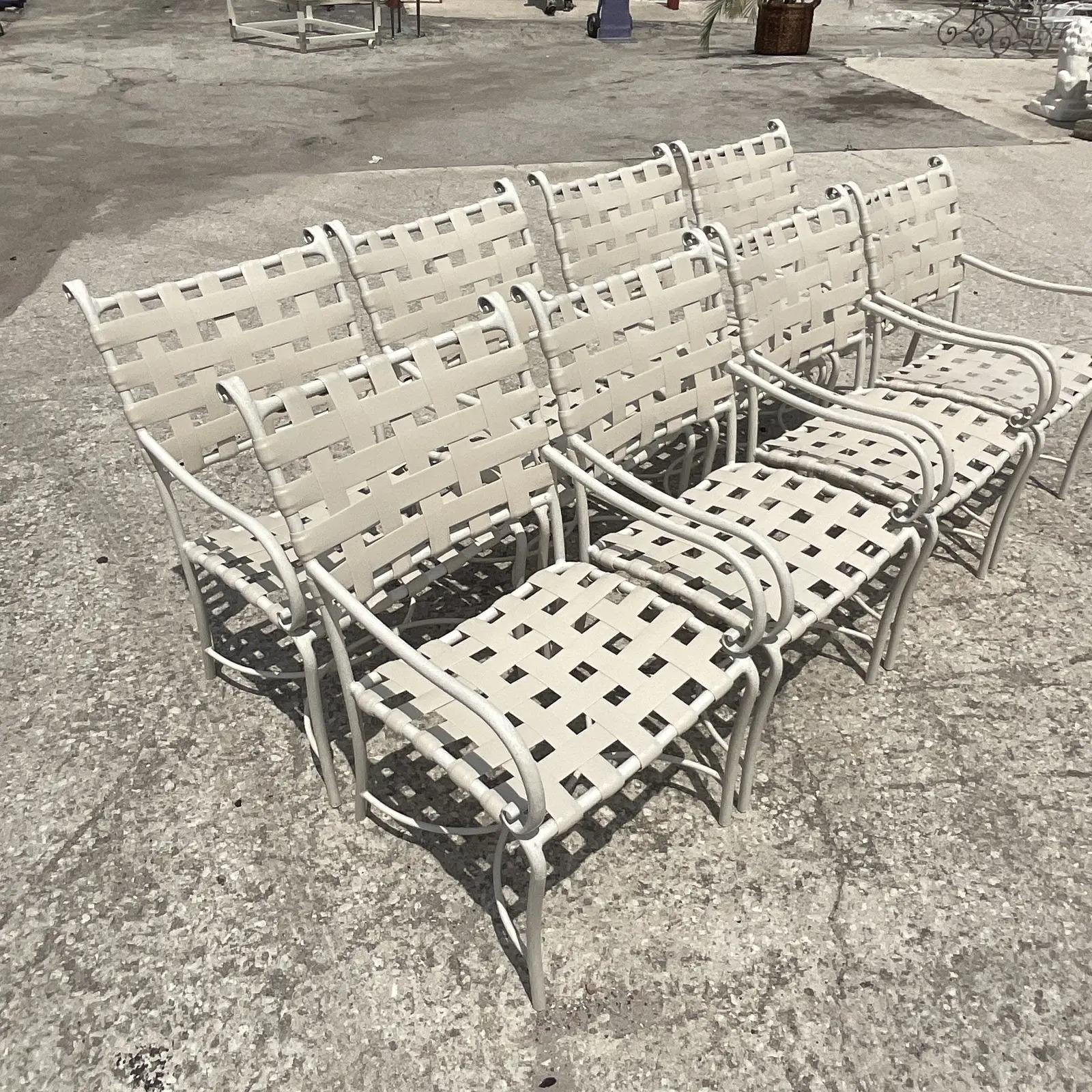 Fantastic set of 8; vintage Coastal outdoor dining chairs. Made by the iconic Brown Jordan group. Powder coated aluminum frame with 2 inch vinyl webbing. Coordinating pieces also available. Unmarked. Acquired from a Miami estate.