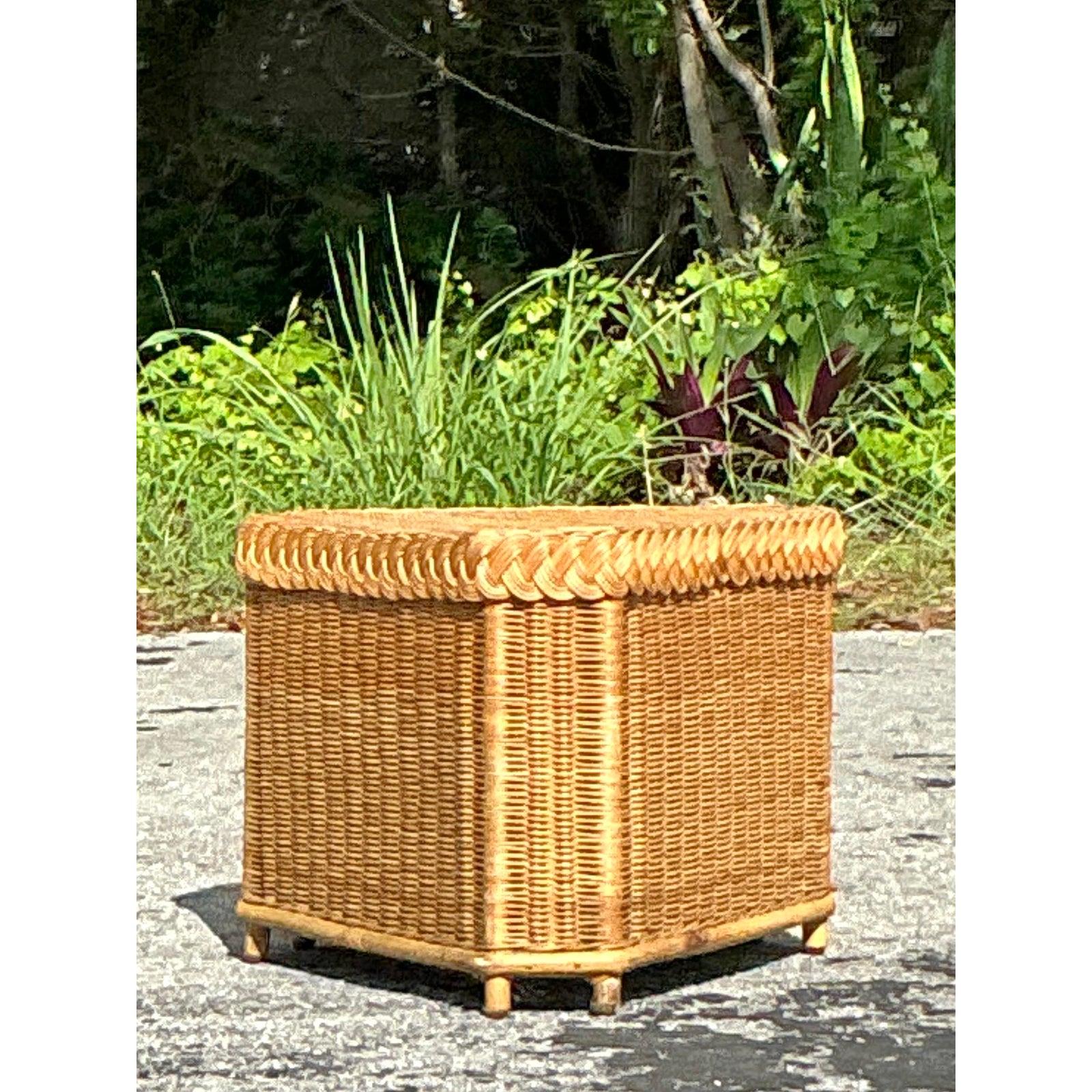 Discover the iconic craftsmanship of Brown Jordan with this exquisite vintage rattan side table. Meticulously hand-woven, this piece showcases a warm, honey-toned patina and intricate wickerwork, including a beautiful braided trim on its lift-off