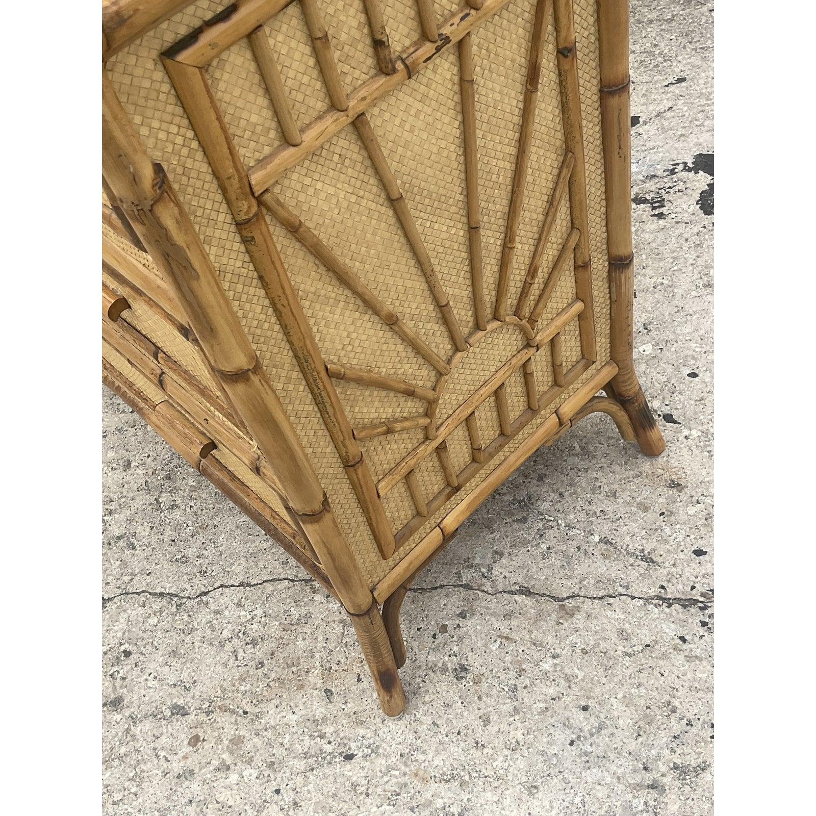 A fantastic Coastal chest of drawers. Beautiful woven rattan cabinet with chic bamboo trim. A fun starburst design on each side. Acquired from a Palm Beach estate.
